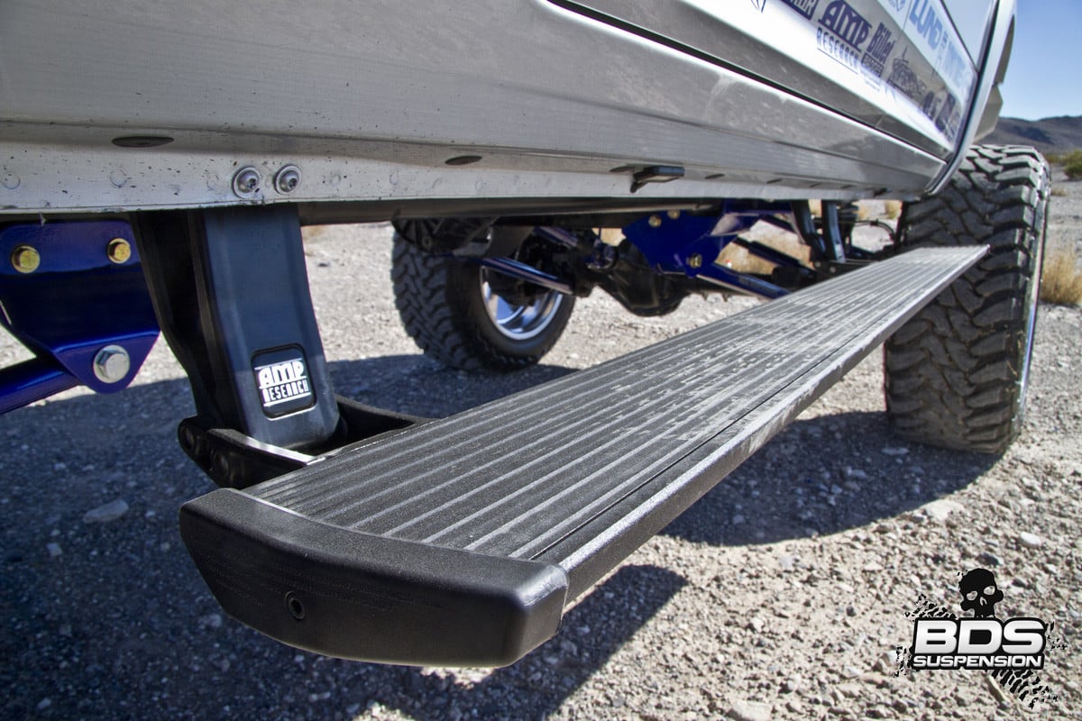 AMP Research power running boards on Lifted Dodge Ram - Photo by BDS Suspensions