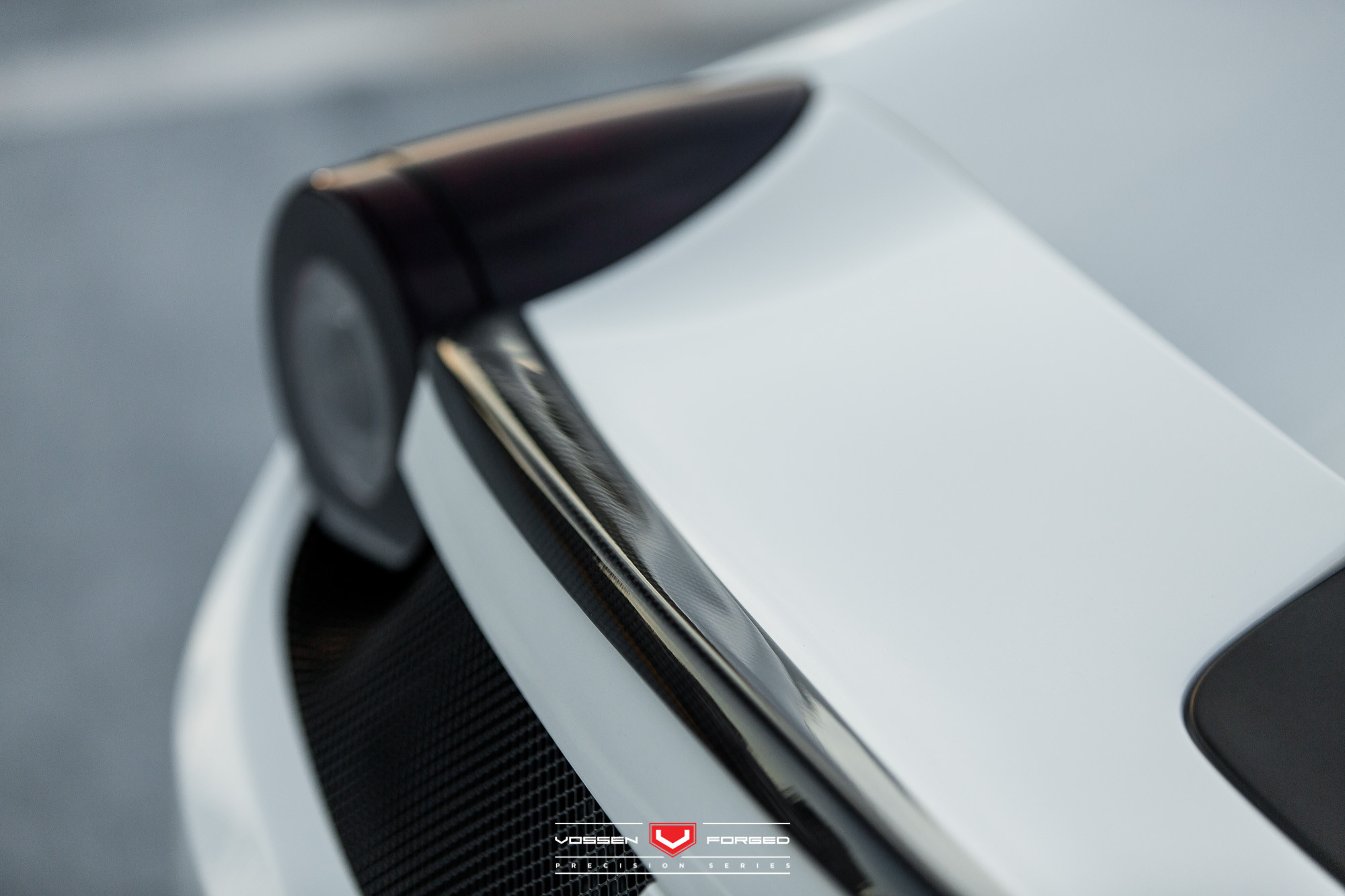 White Ferrari 458 with Aftermarket Carbon Fiber Rear Lip Spoiler - Photo by Vossen