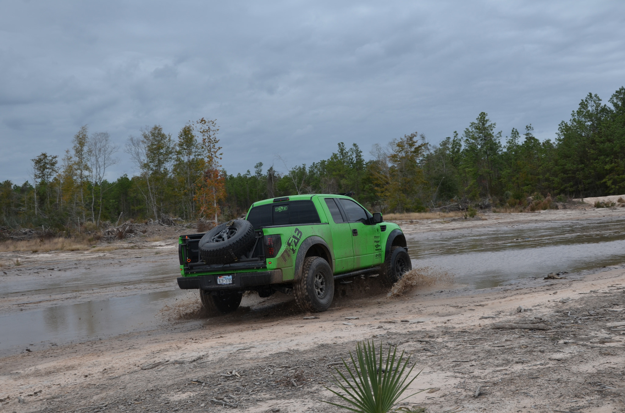 First gen Raptor Wheeling in Mud - Photo by Black Rhino