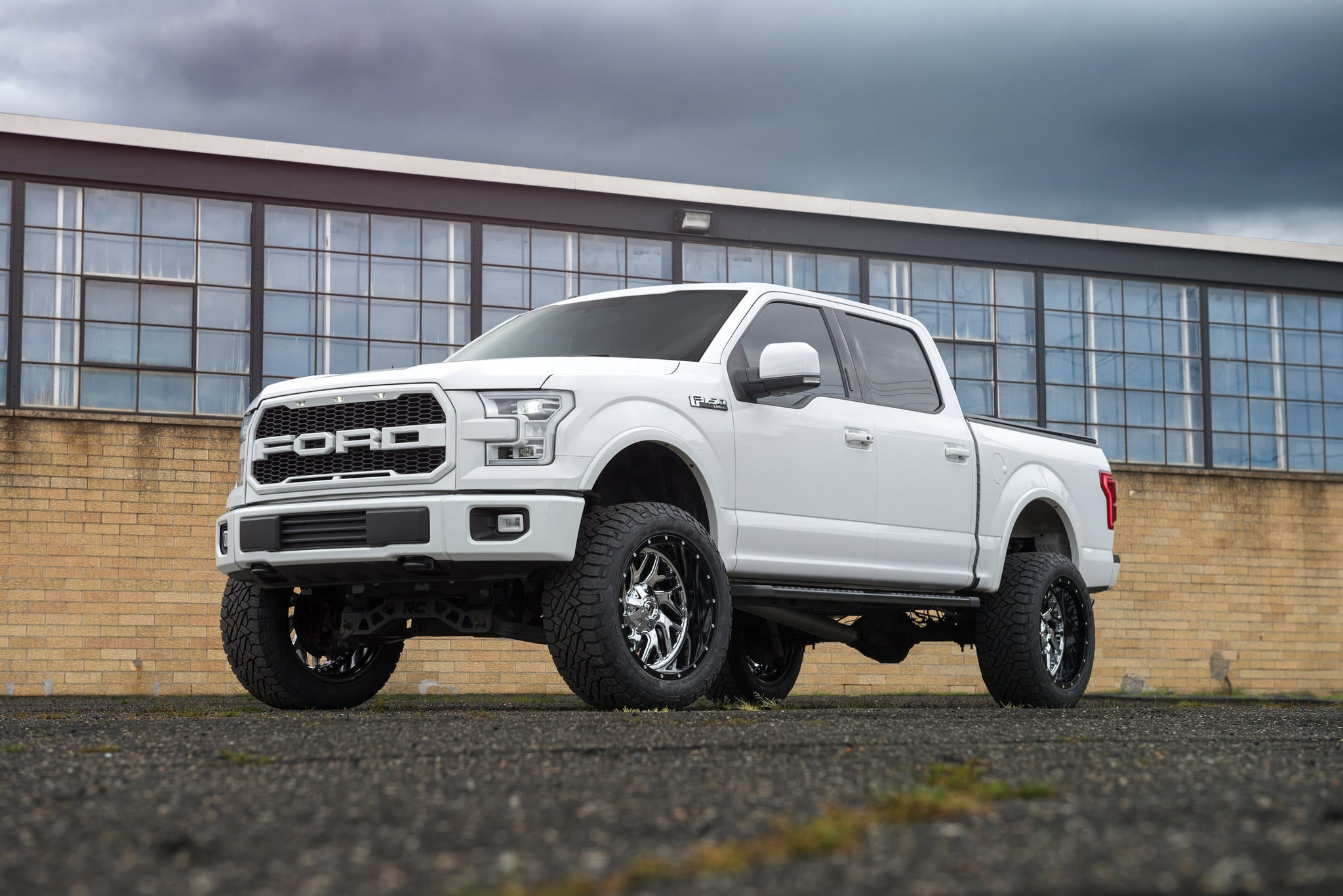 White Lifted Ford F-150 with Custom Headlights - Photo by Fuel Offroad