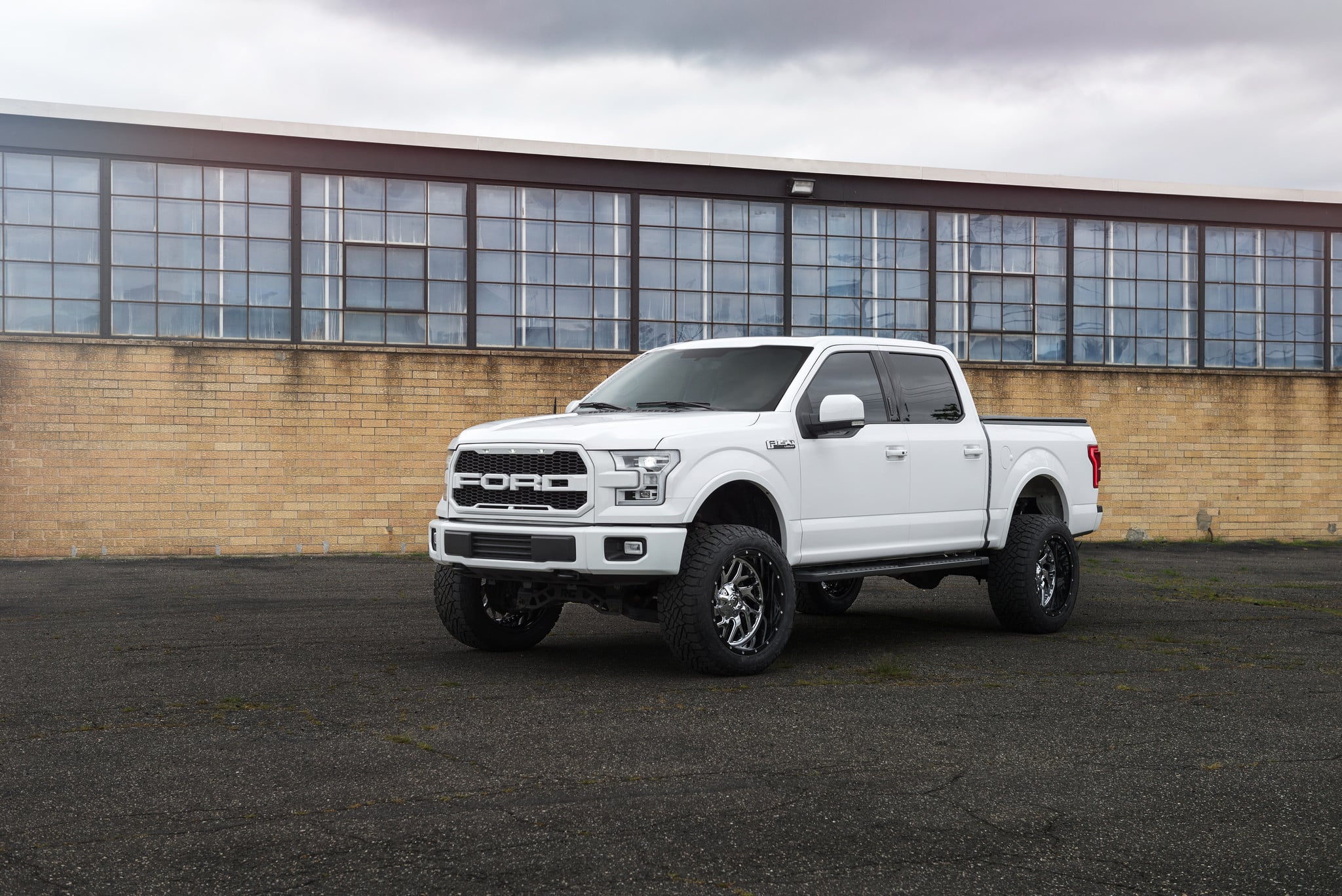 White Lifted Ford F-150 Running Boards - Photo by Fuel Offroad