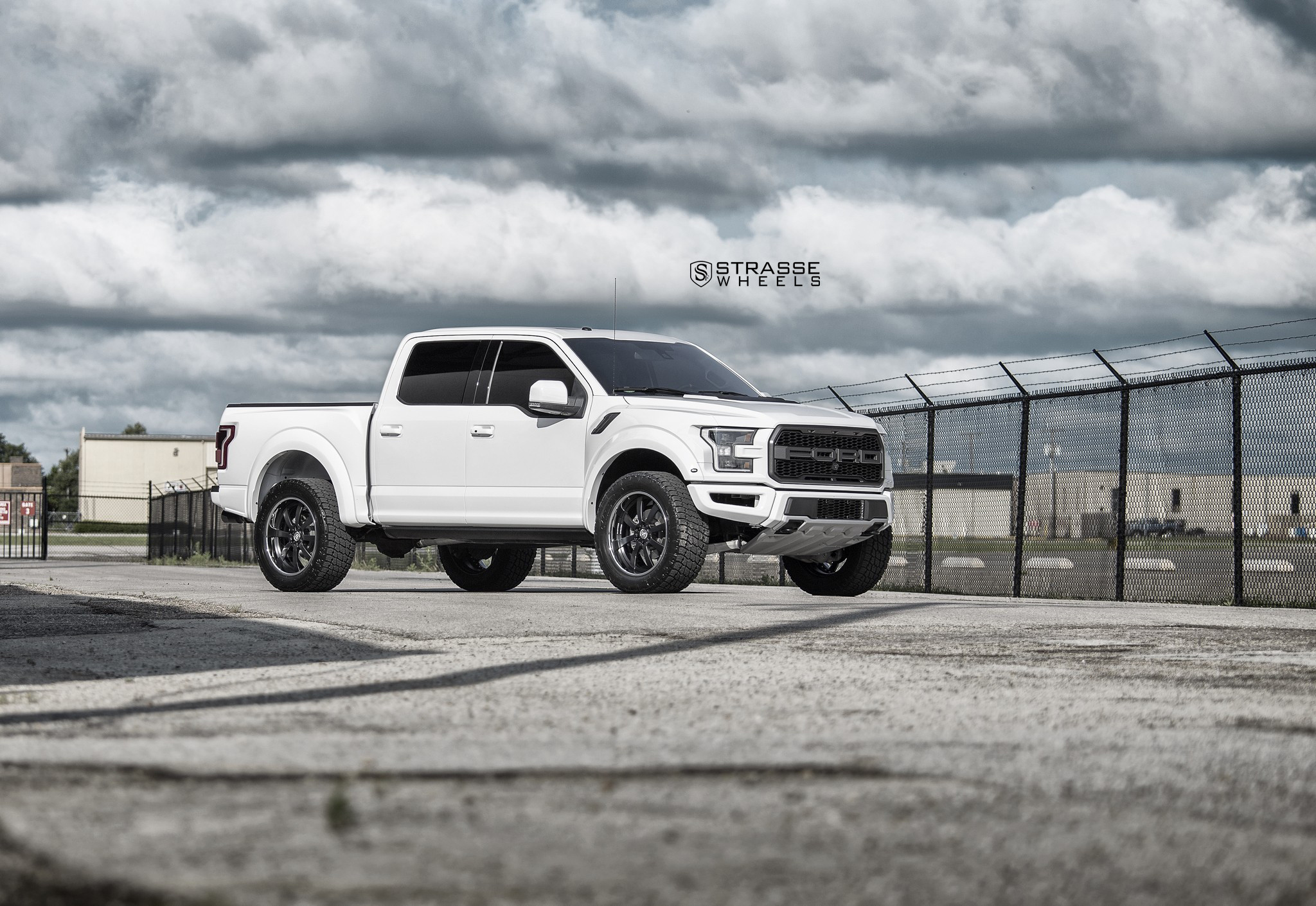 White Lifted Ford F-150 with Aftermarket Running Boards - Photo by Strasse Forged