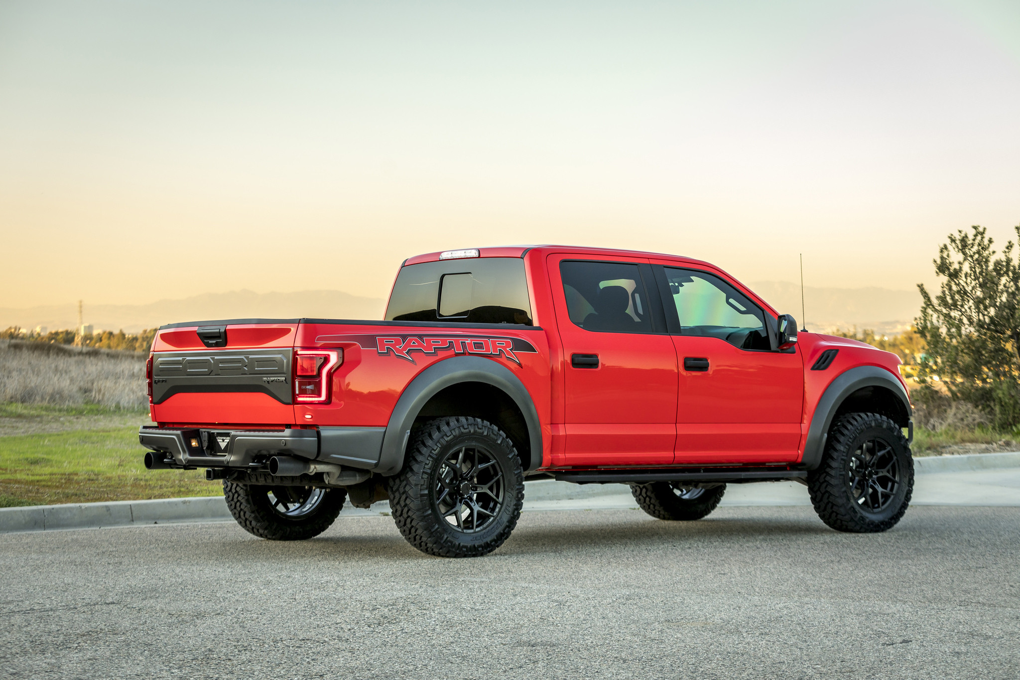 Aftermarket Rear Bumper on Red Ford F-150 - Photo by Vorsteiner