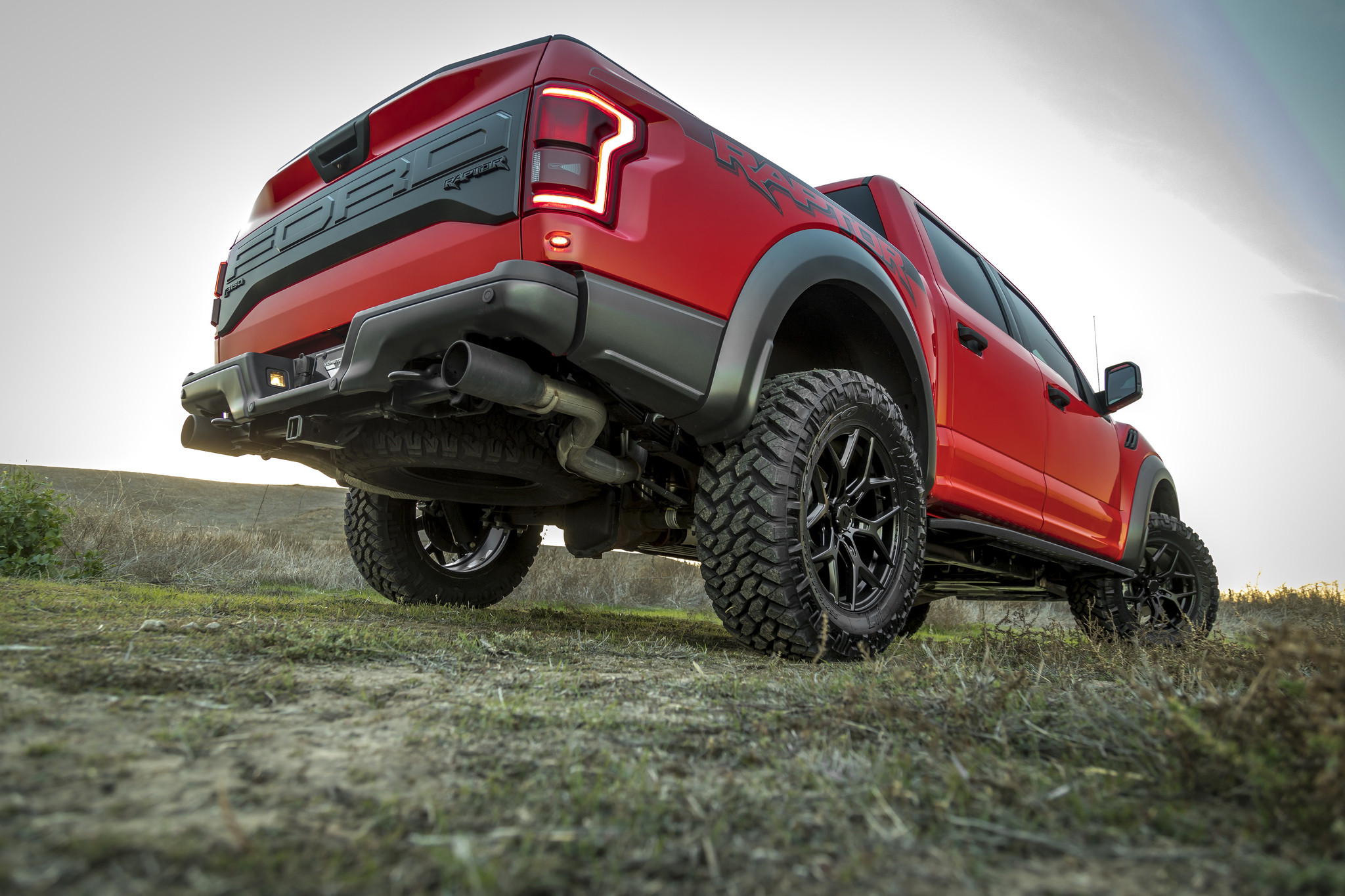 Custom Exhaust System on Red Ford F-150 - Photo by Vorsteiner