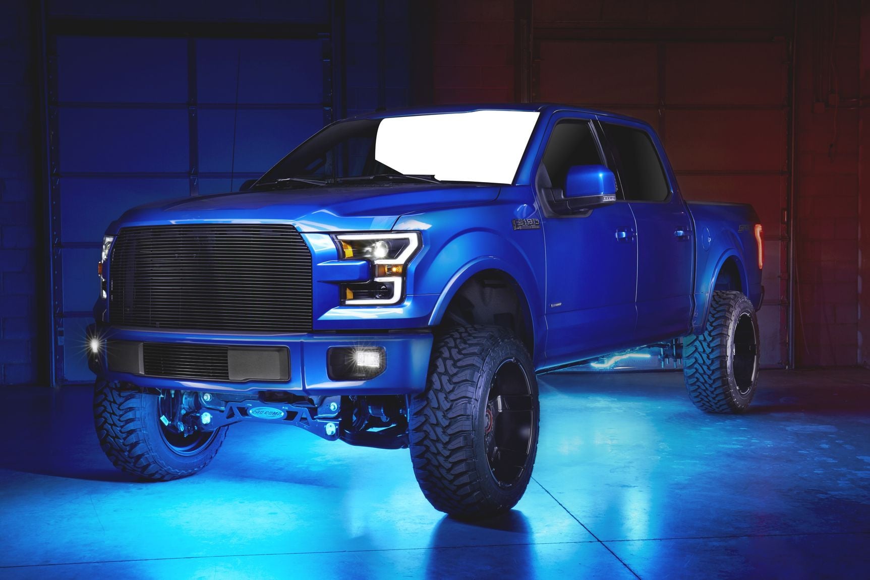 Blue Lifted Ford F-150 with Custom LED Bar Headlights - Photo by CARiD