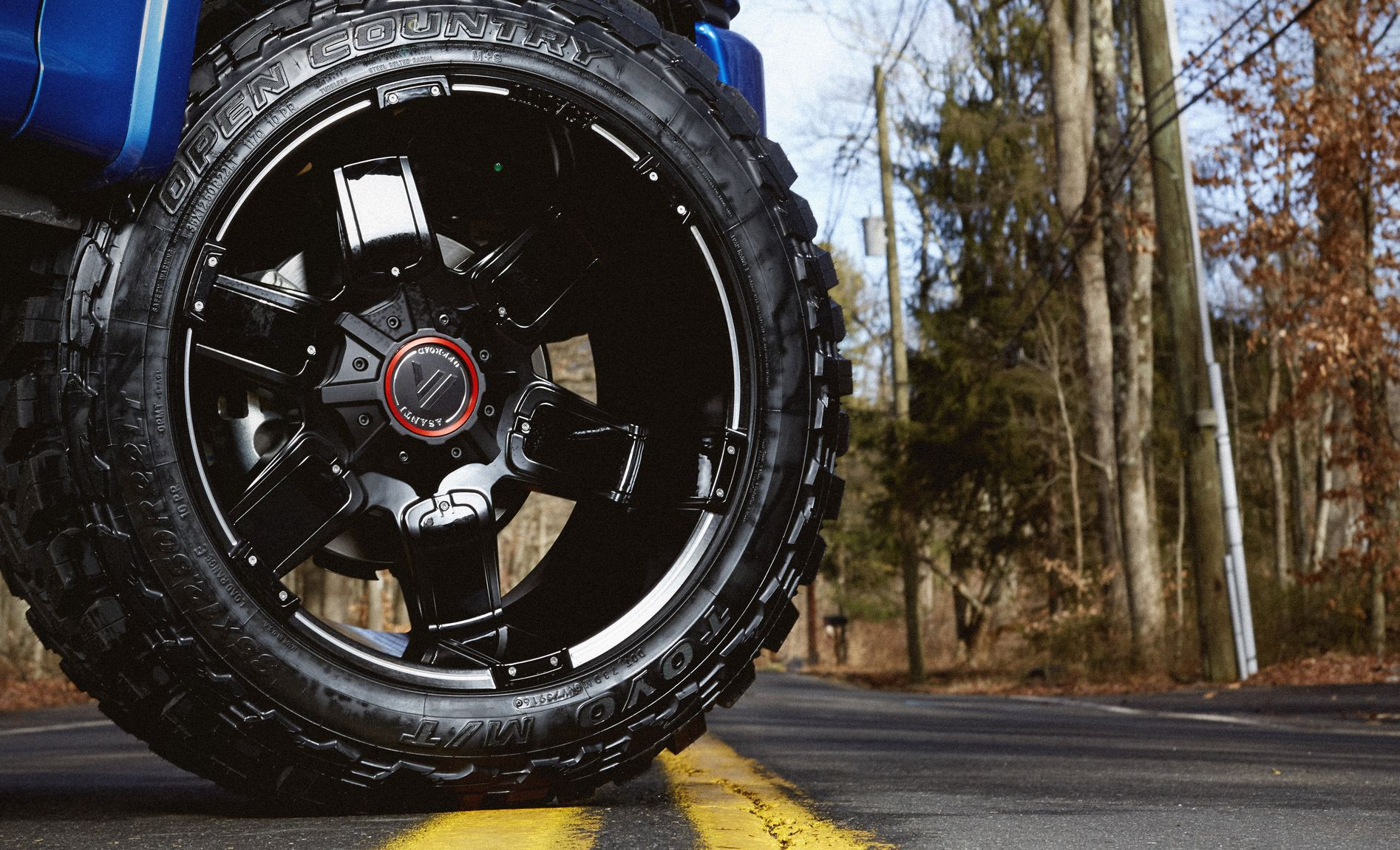 Blue Lifted Ford F-150 with Off-road Asanti Wheels - Photo by CARiD