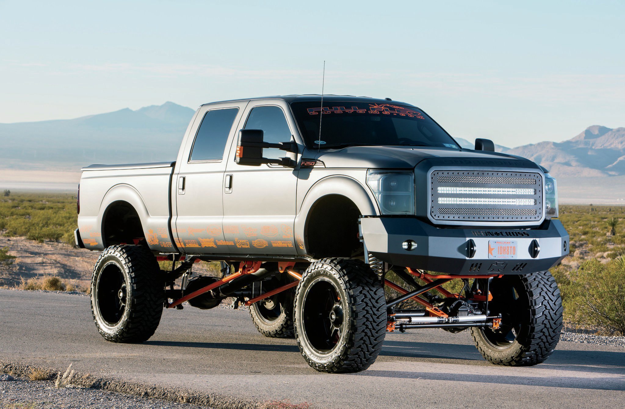 Lifted F250 On 40 Inch Mud Tires and Iron Cross Steel Bumpers - Photo by Le...