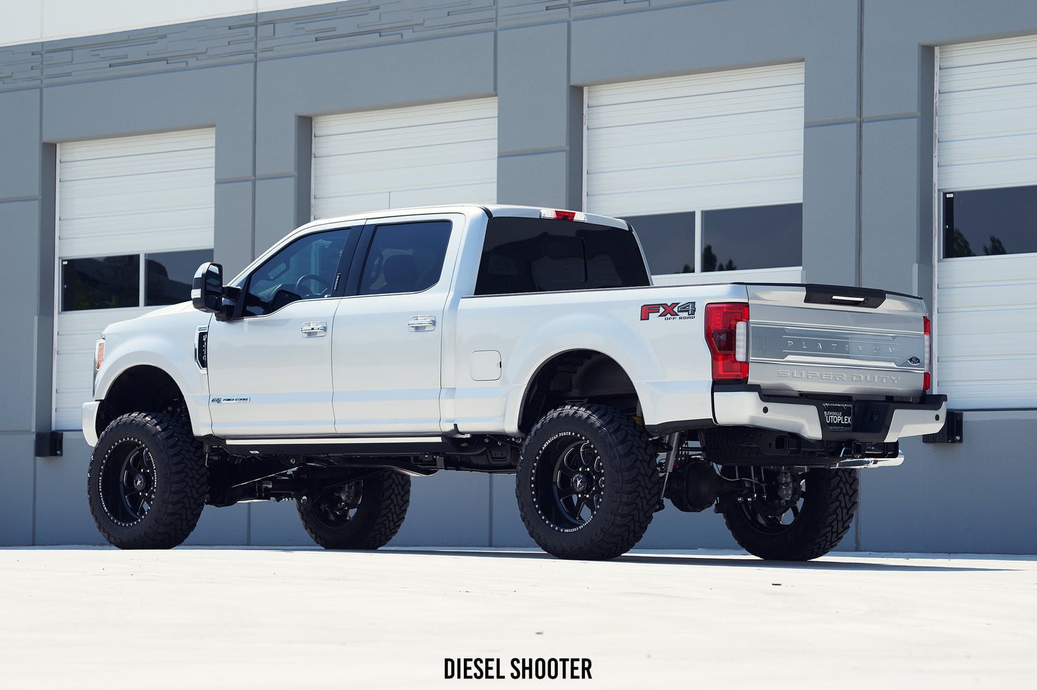 Retractable Running Boards on Lifted Ford F-250 - Photo by Diesel Shooter