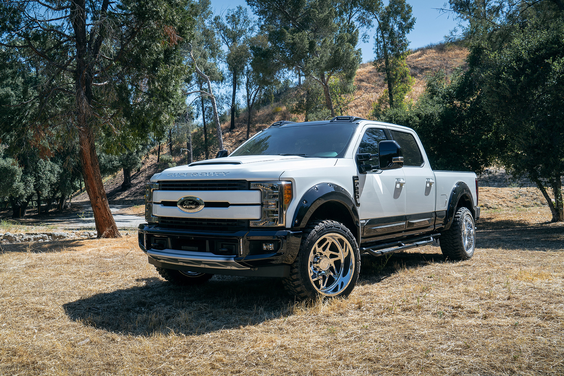 Custom Front Bumper on White Ford F-250 Super Duty - Photo by Forgiato
