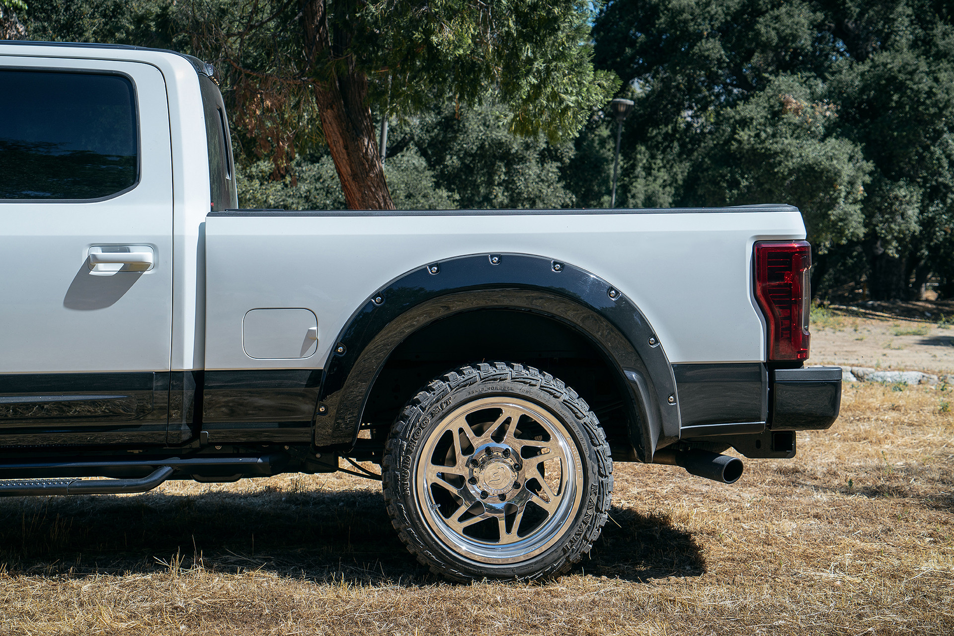 Custom Pocket Style Fender Flares on White Ford F-250 - Photo by Forgiato