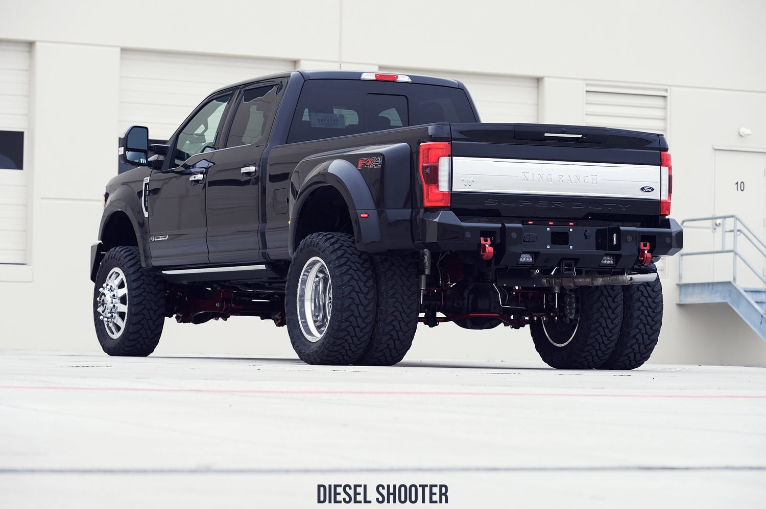 Rear Bumper with Tow Hooks on Black Ford F-350 - Photo by Diesel Shooter