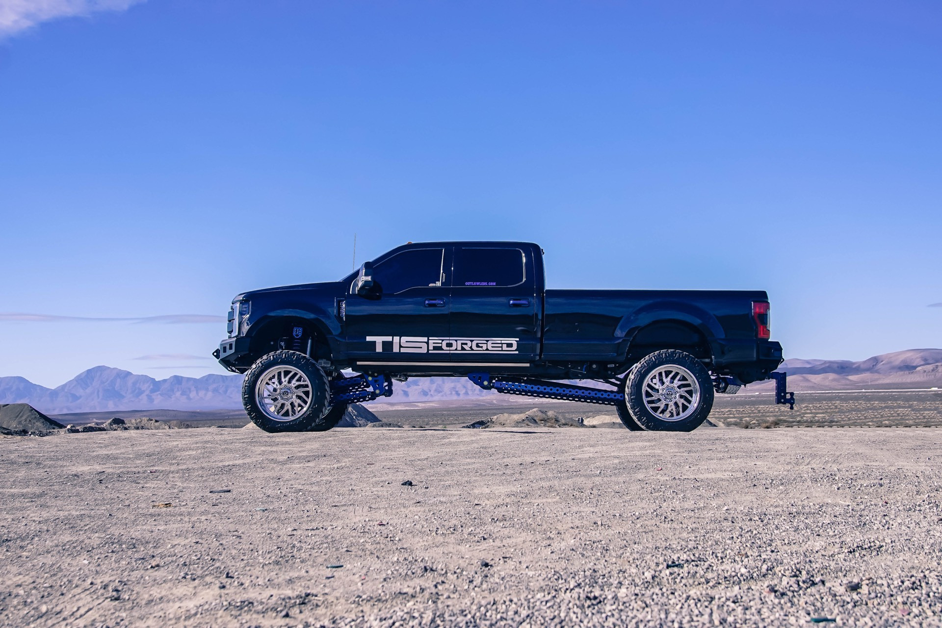 Custom Lift Kit on Black Lifted Ford F-350 - Photo by TIS Wheels