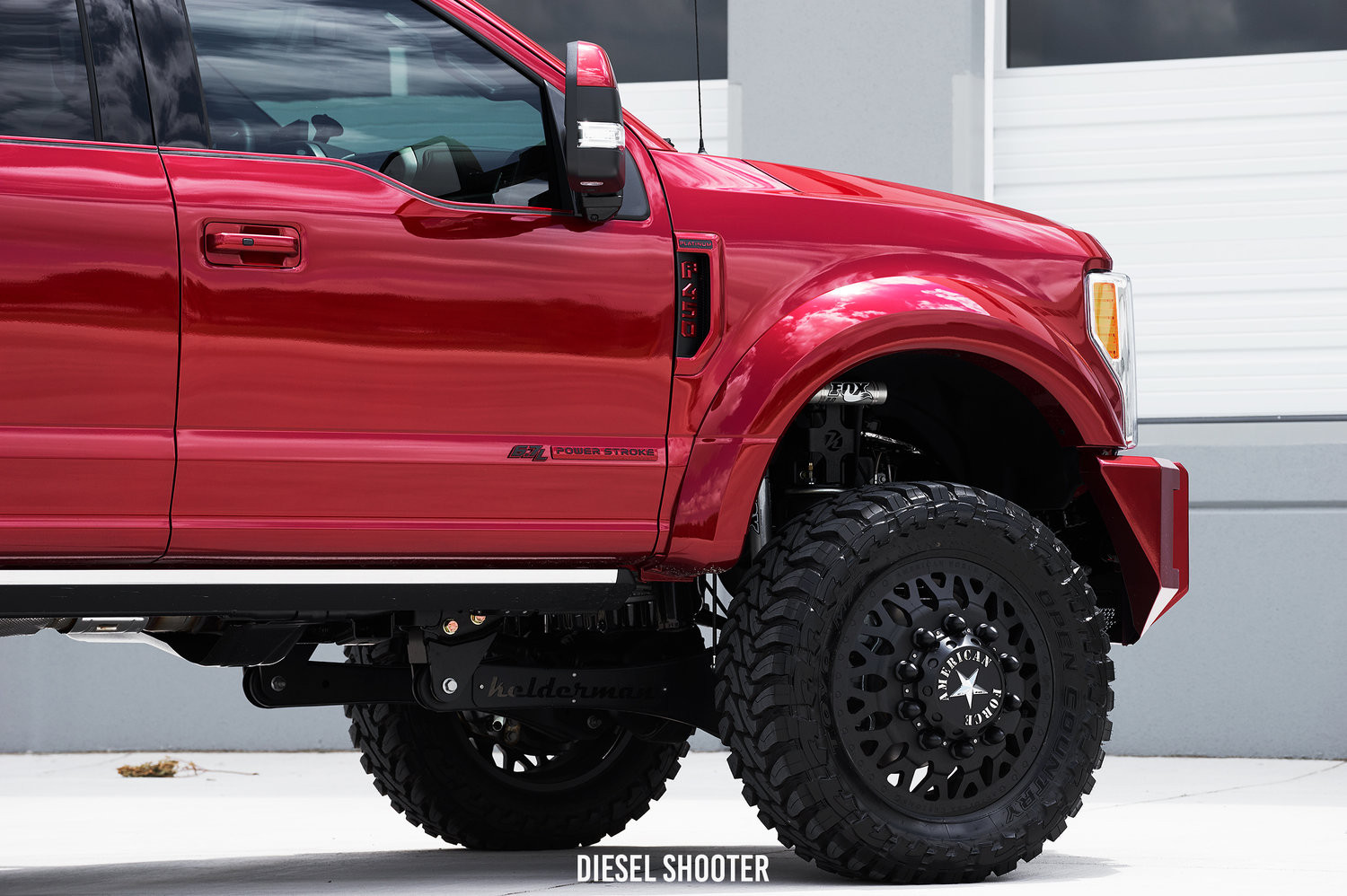 Red Ford F-450 6.7L with Custom Lift Kit and Fox Shocks - Photo by Diesel Shooter