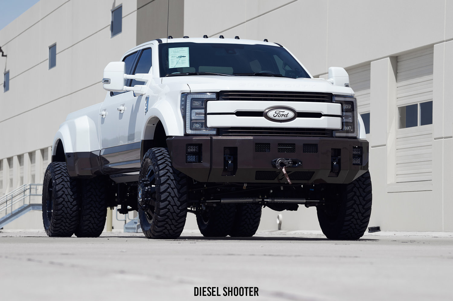 Custom Off-road Bumper with Monster Tow Hooks on Lifted Ford F-450 - Photo by Diesel Shooter