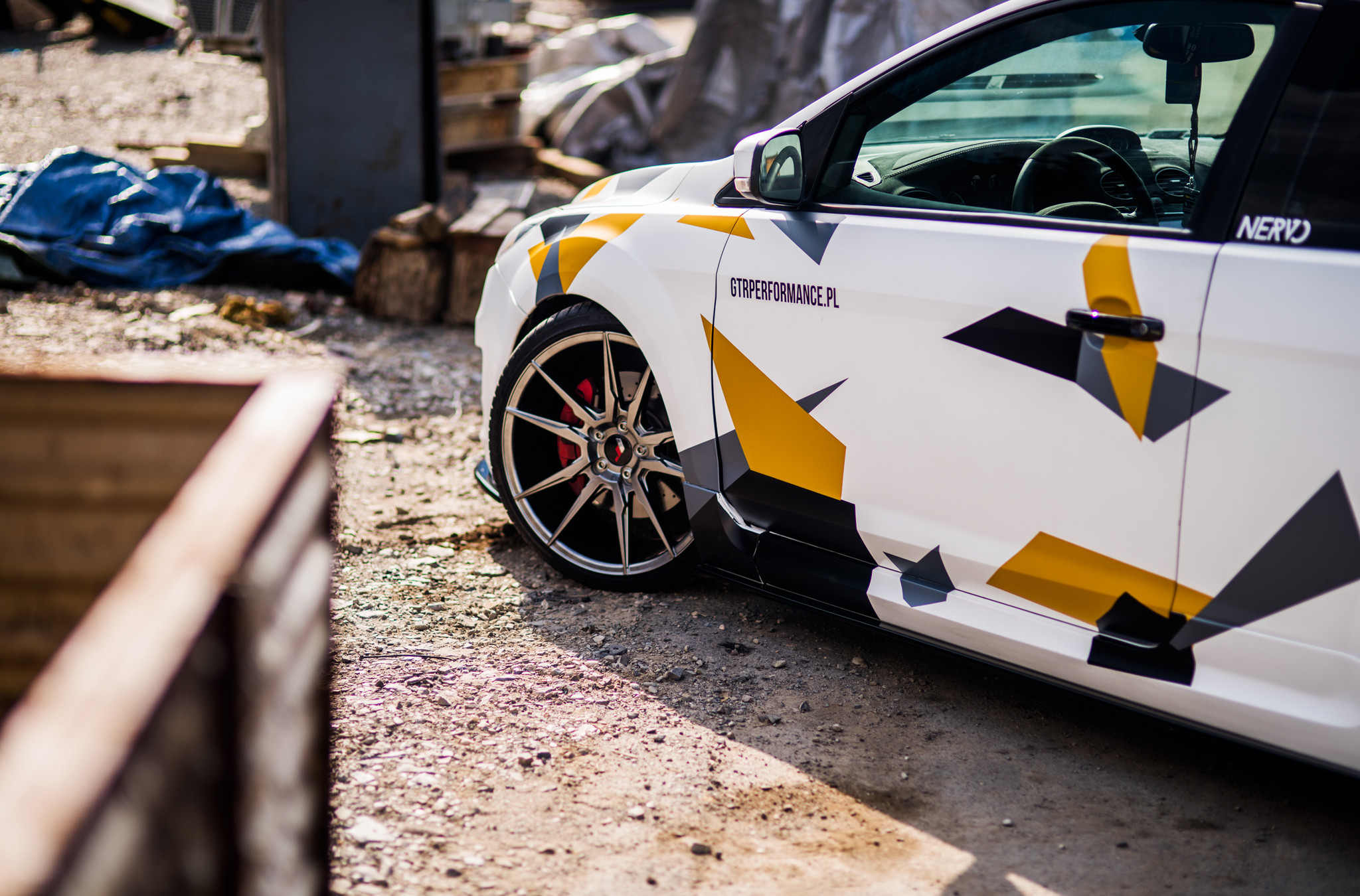 White Ford Focus with Charcoal Gray JR Wheels - Photo by JR Wheels