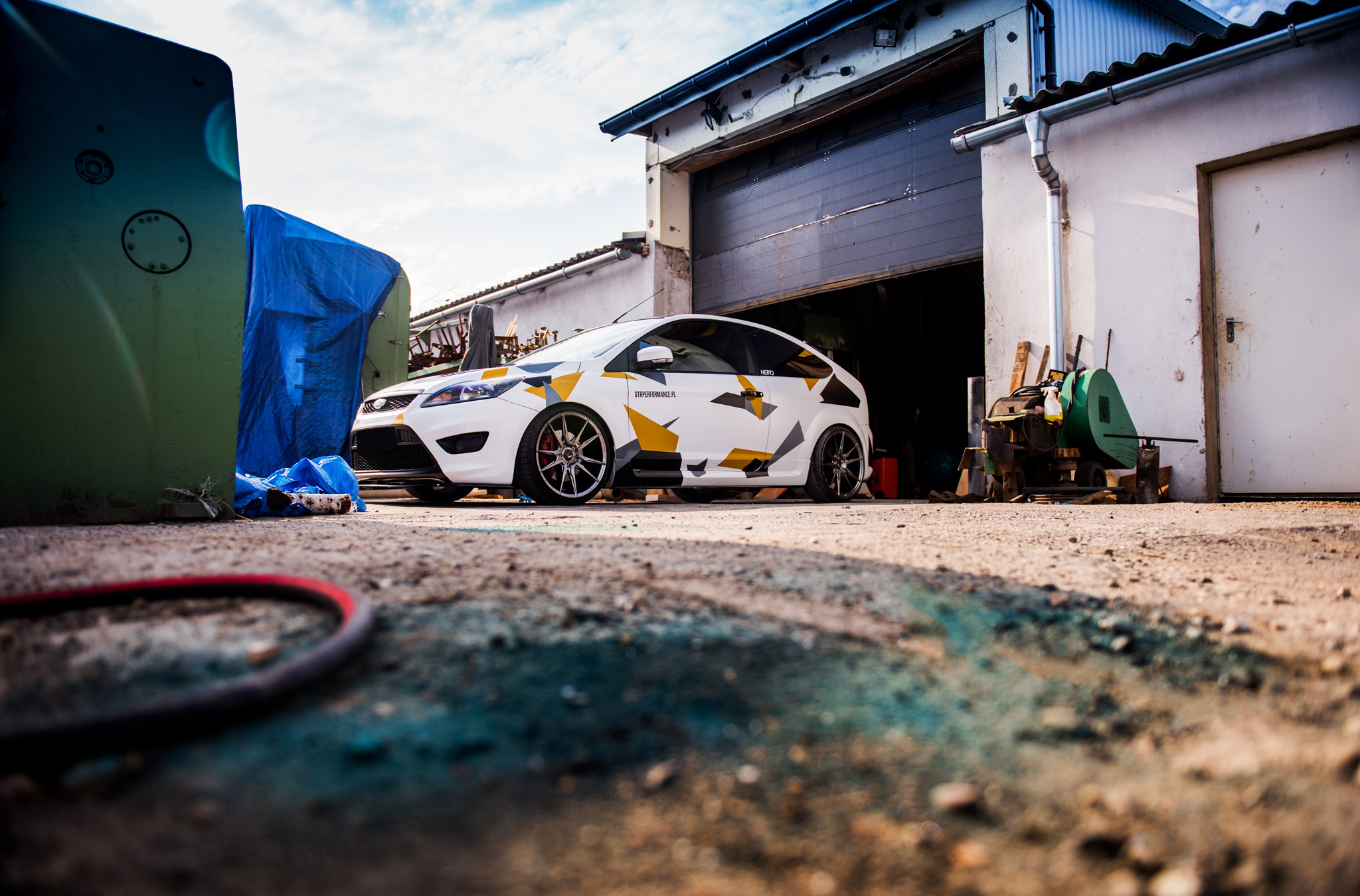 Custom Front Bumper on White Ford Focus - Photo by JR Wheels