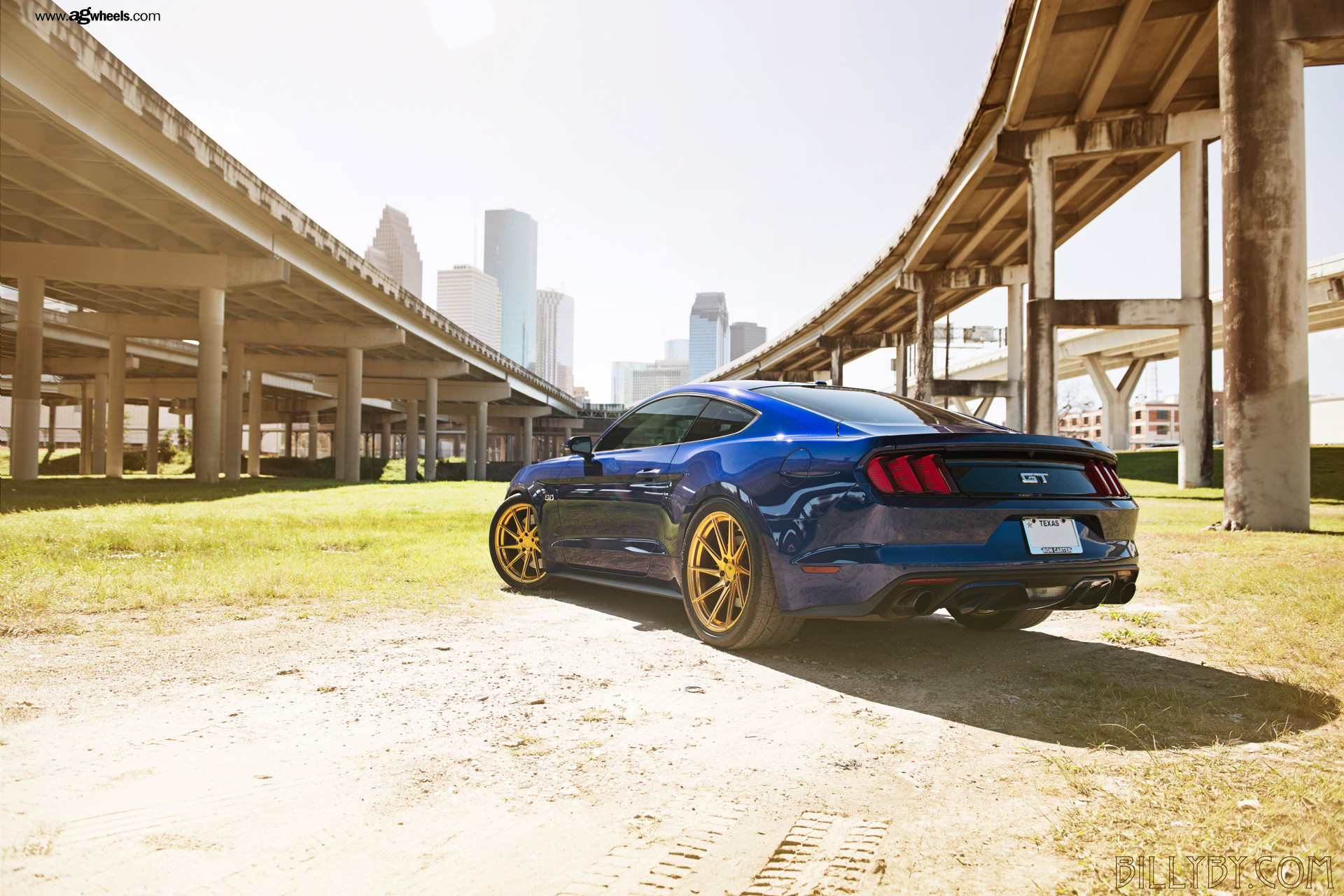 Blue Ford Mustang GT 5.0 on Gold Custom Wheels - Photo by Avant Garde