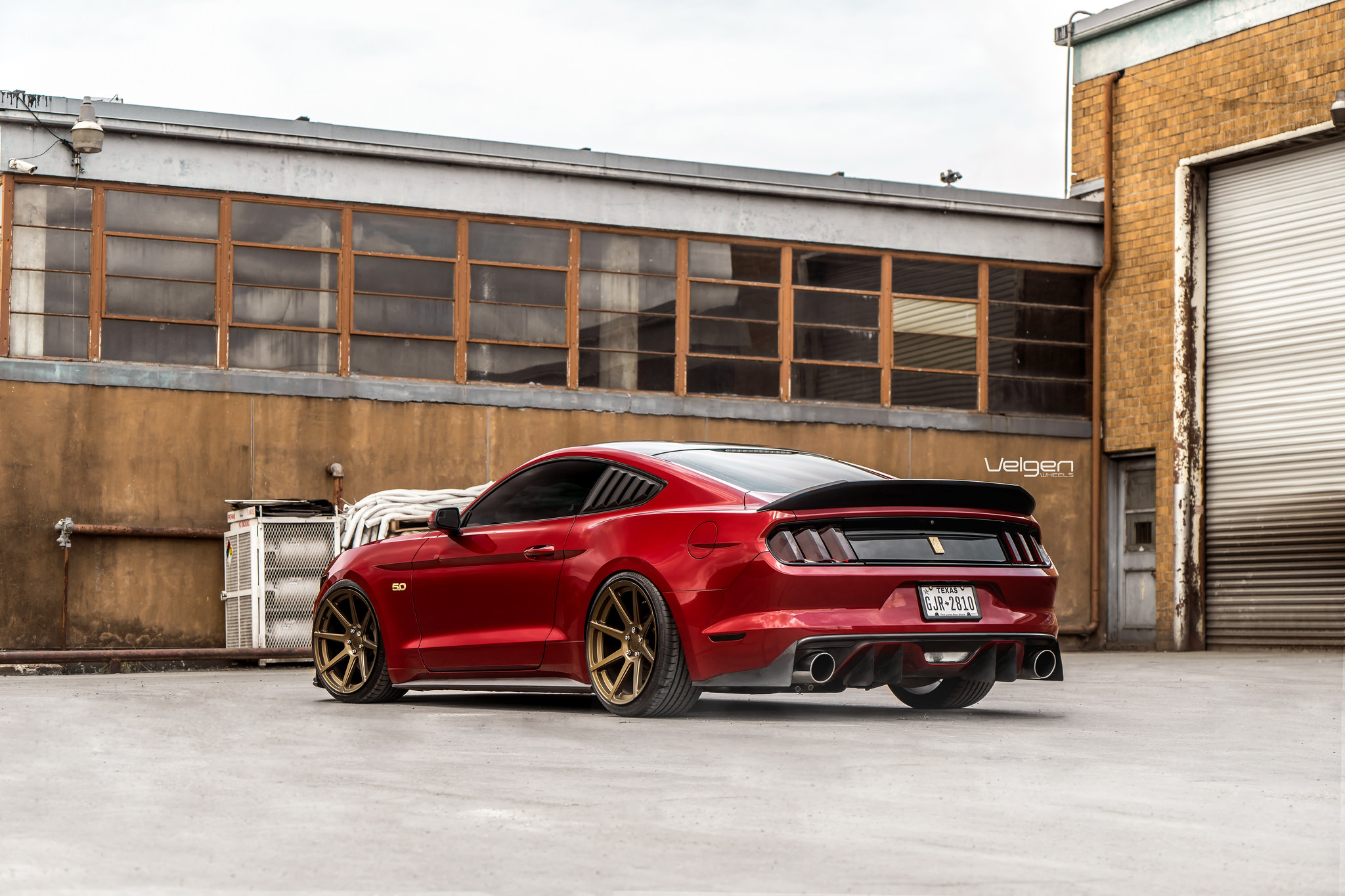Rear Diffuser with Single Exhaust Tips on Custom Red Ford Mustang - Photo by Velgen