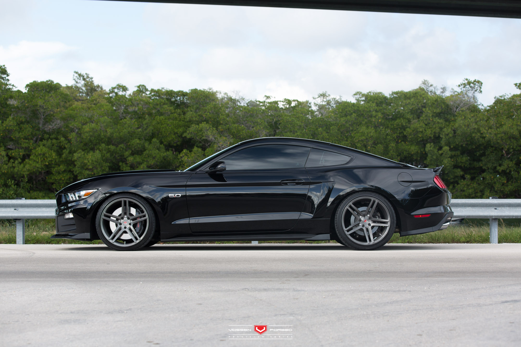 Aftermarket Side Skirts on Black Ford Mustang - Photo by Vossen