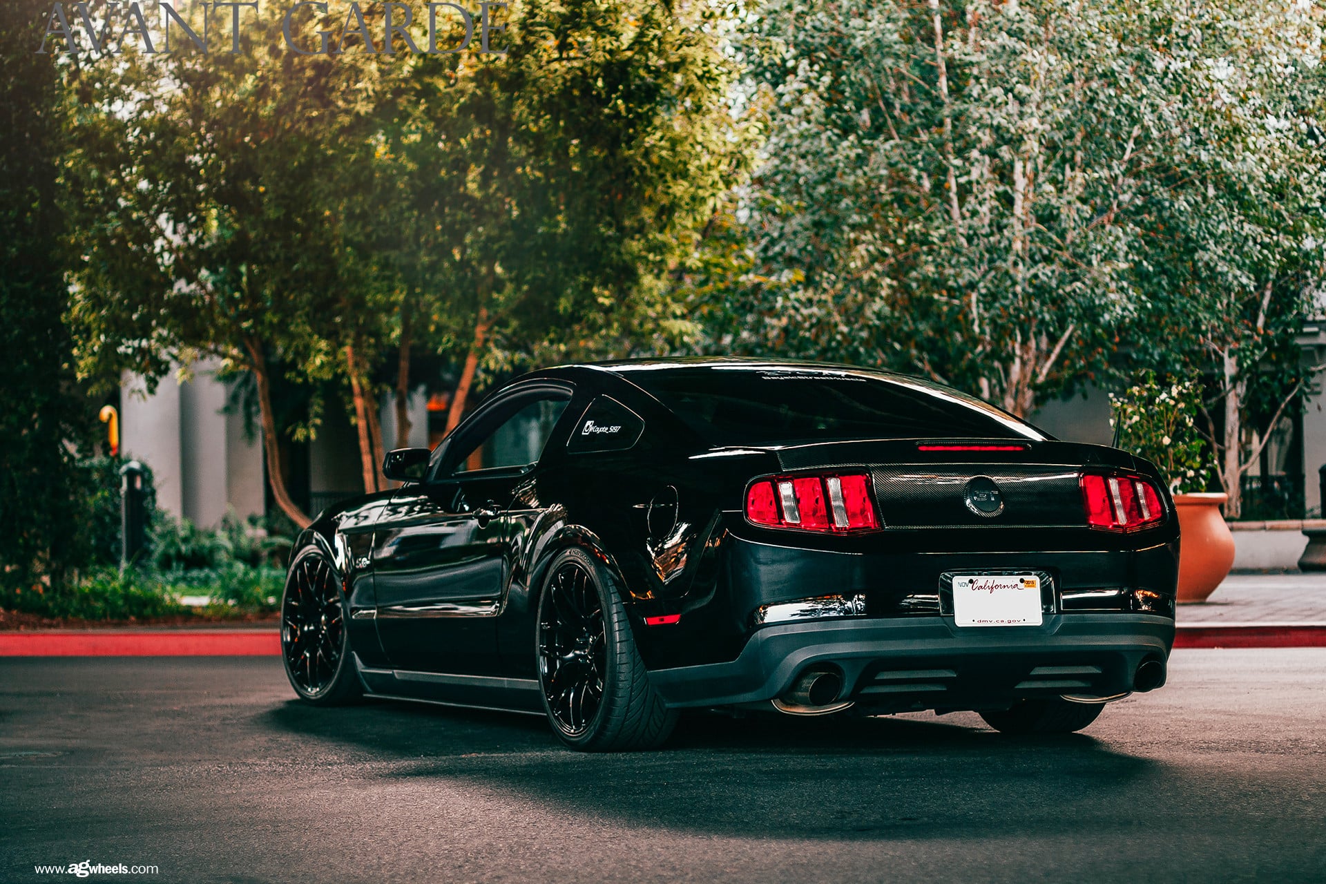 Carbon Fiber Rear Bumper on Black Ford Mustang - Photo by Avant Garde Wheels