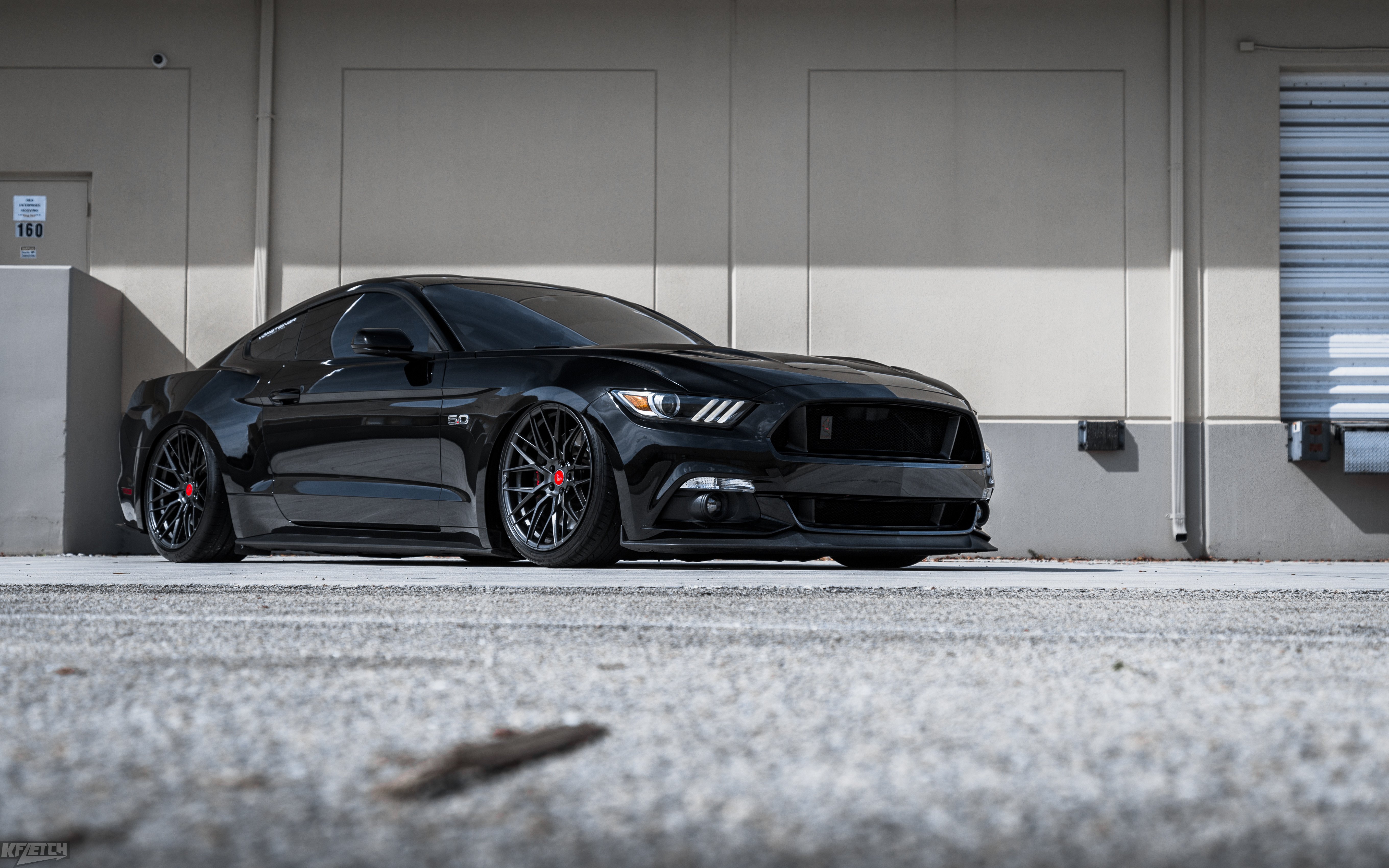 Black Ford Mustang with Aftermarket Headlights - Photo by Vorstiner