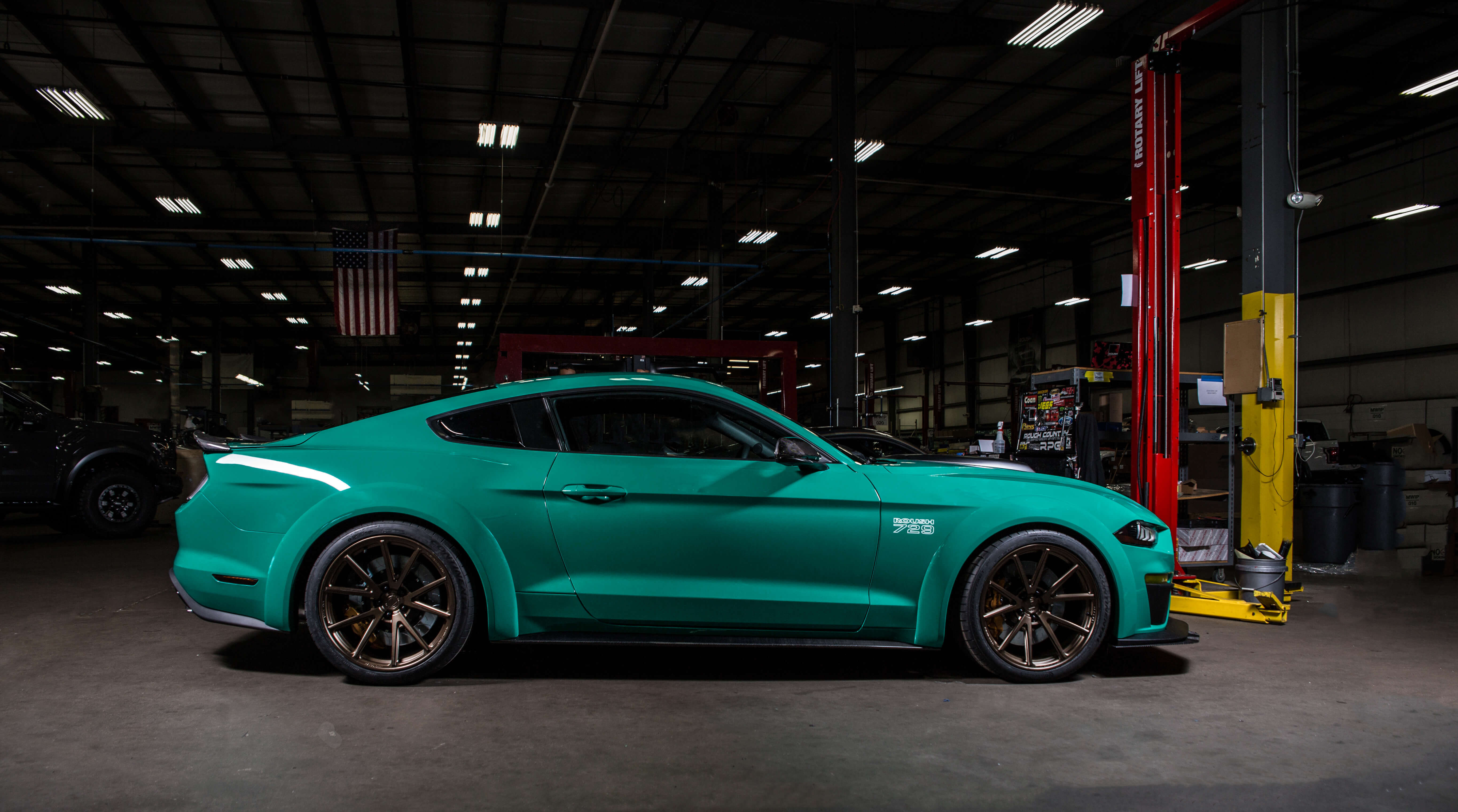 Carbon Fiber Side Skirts on Green Ford Mustang - Photo by Roush Performance