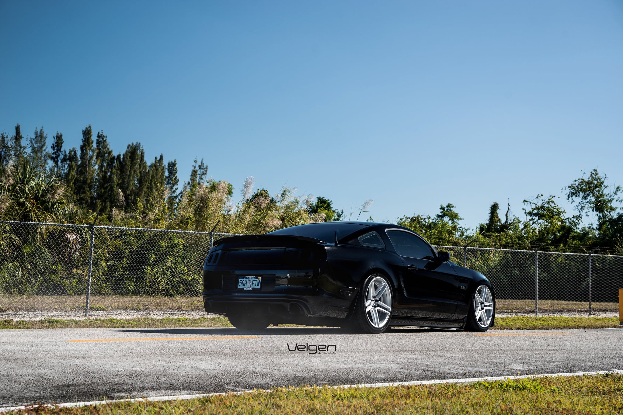 Custom Style Rear Spoiler on Black Ford Mustang - Photo by Velgen