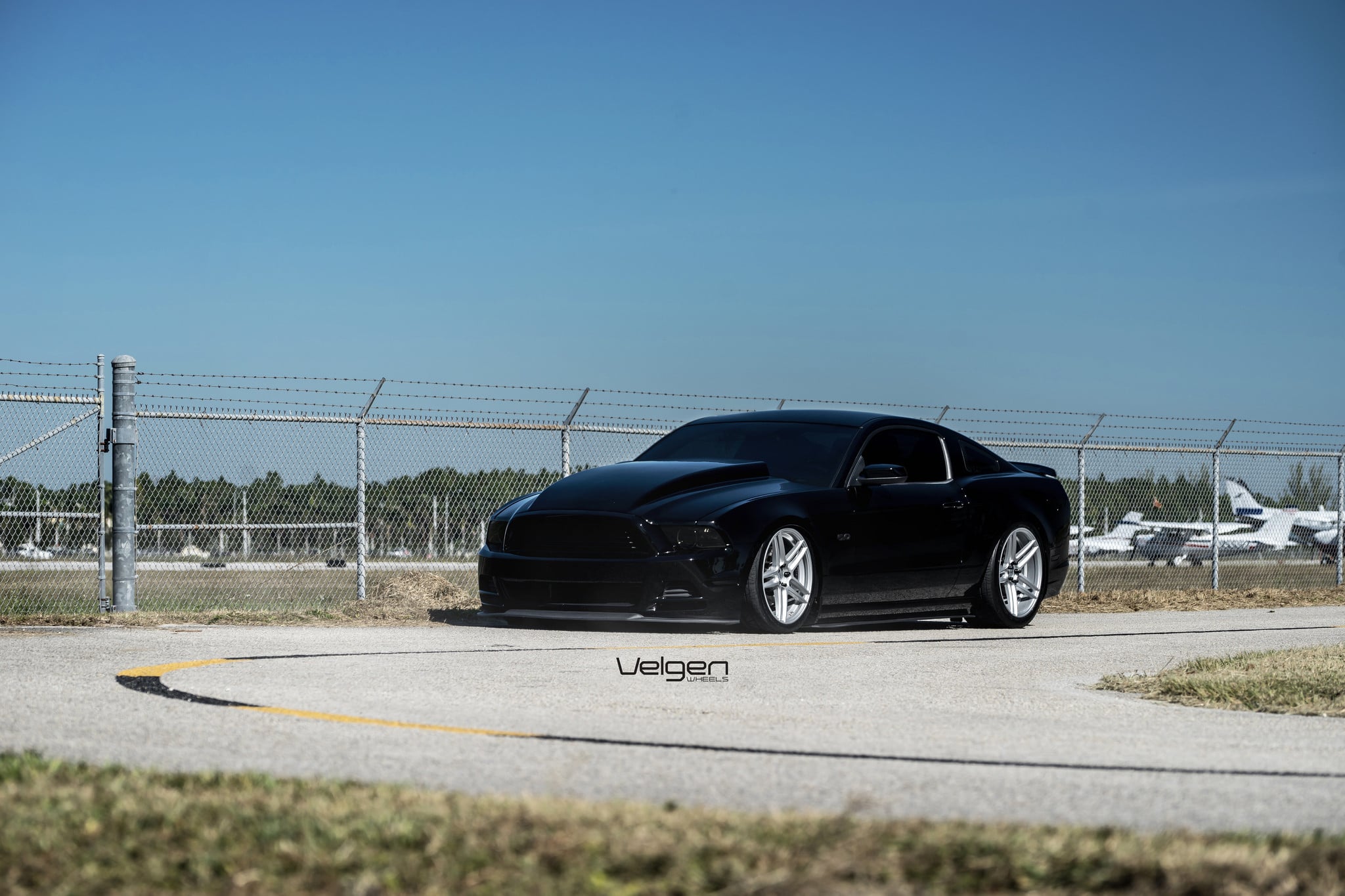 Black Ford Mustang with Custom Dark Smoke Headlights - Photo by Velgen