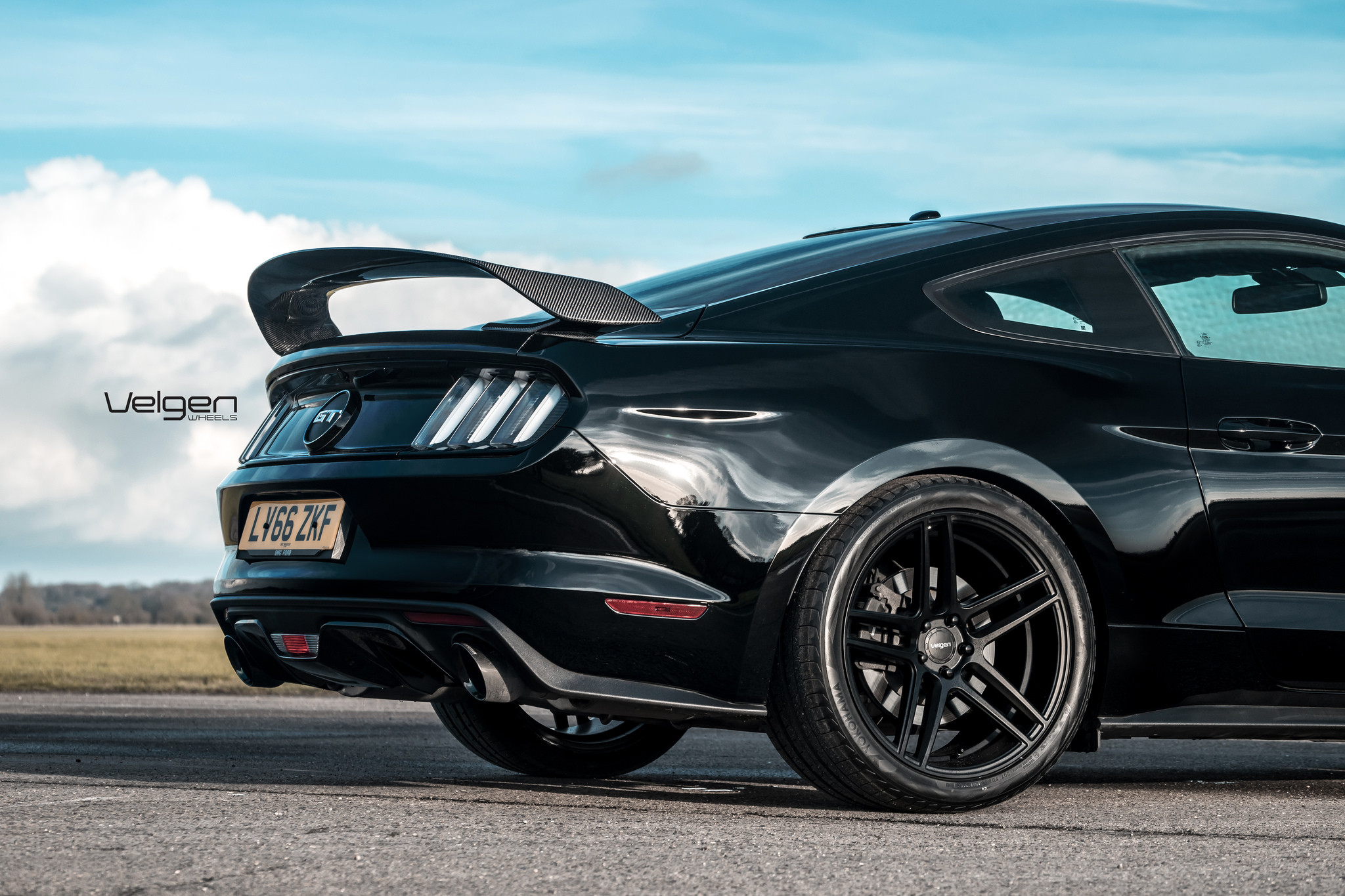 Black Ford Mustang with Carbon Fiber Rear Spoiler - Photo by Velgen
