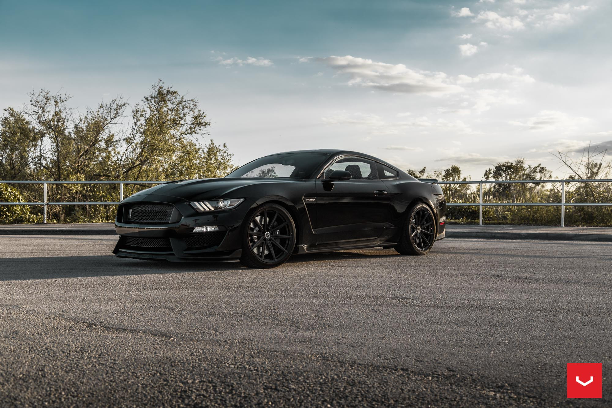 Black Ford Mustang with Aftermarket Projector Headlights - Photo by Vossen