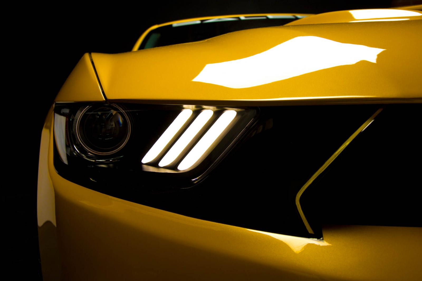 Black Ford Mustang headlights With LED Bars - Photo by Saleen