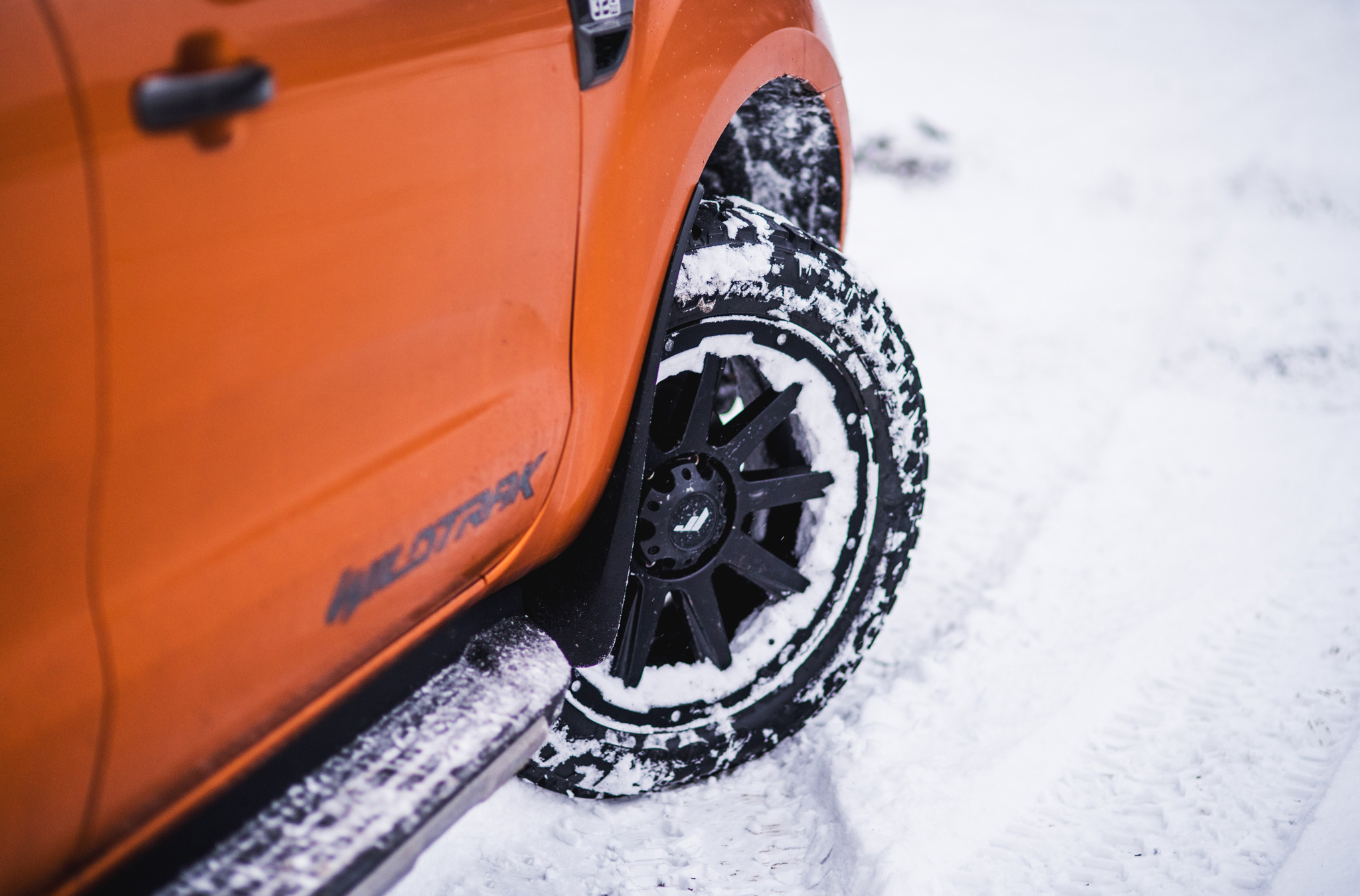 Orange Ford Ranger with Custom Running Boards - Photo by JR Wheels