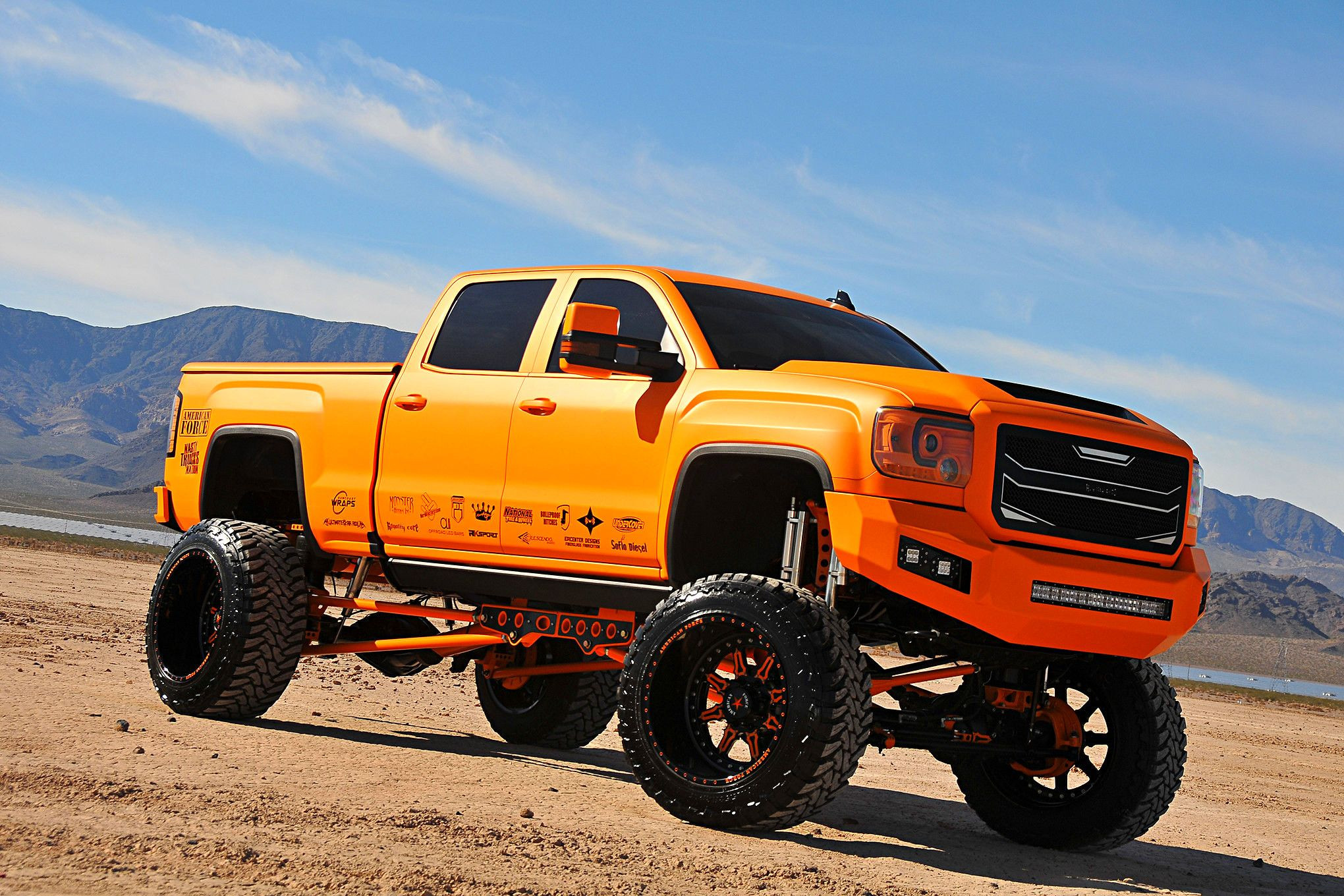 American Force Custom Wheels on Orange GMC Sierra - Photo by Phil Gordon