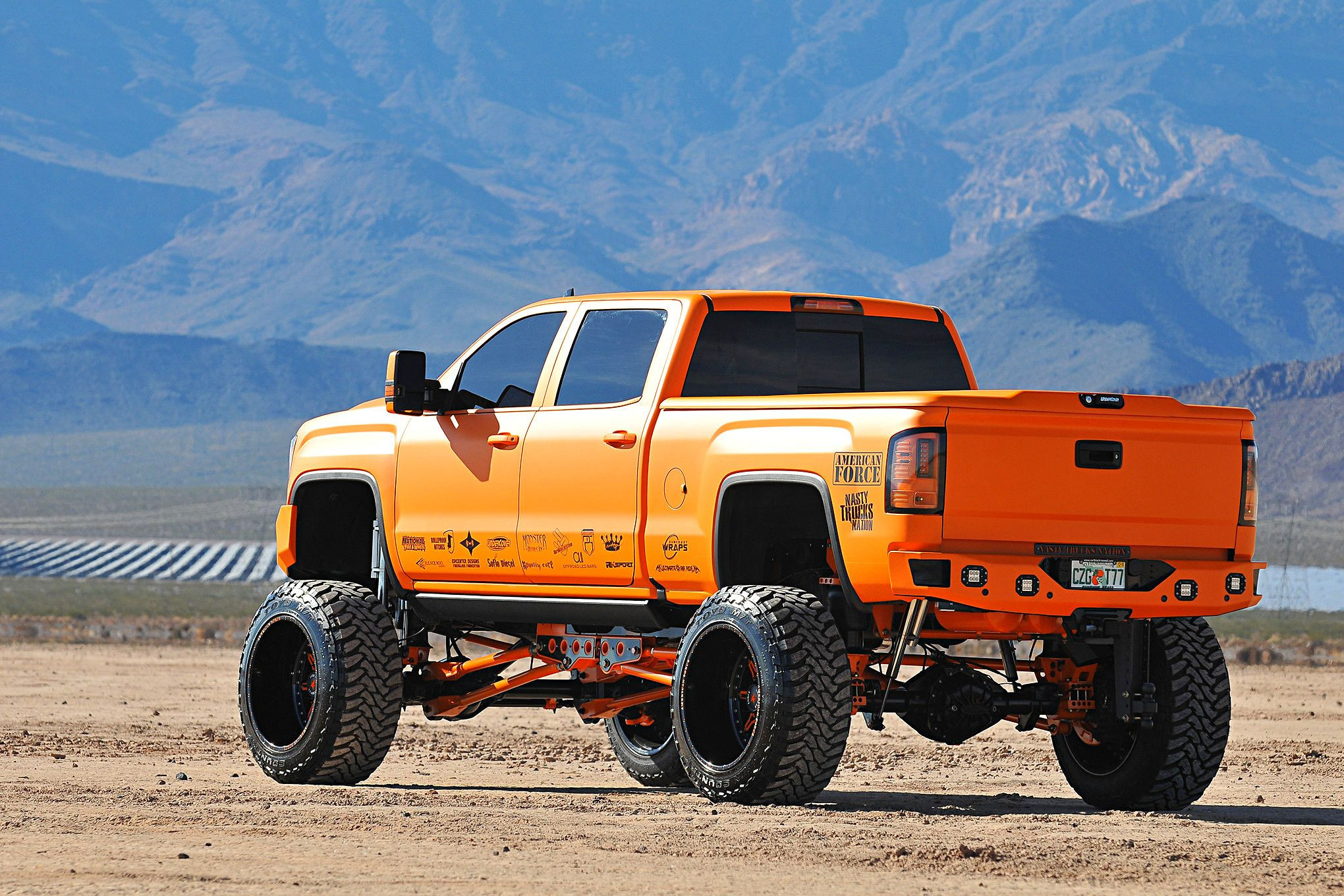 Suncoast Matte Orange GMC Sierra on Custom Lift Kit - Photo by Phil Gordon