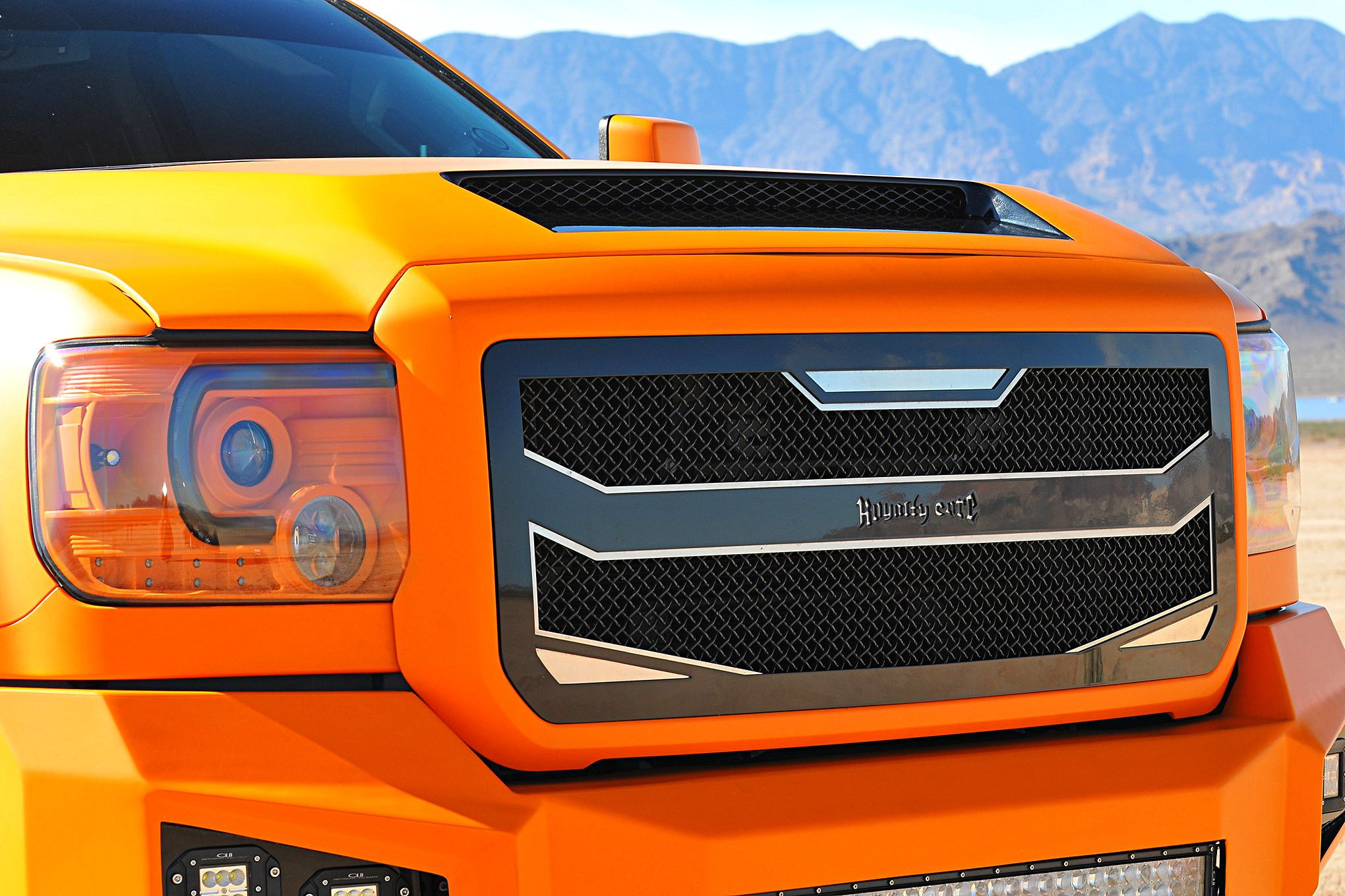 Orange GMC Sierra with Royalty Core Custom Grille - Photo by Phil Gordon