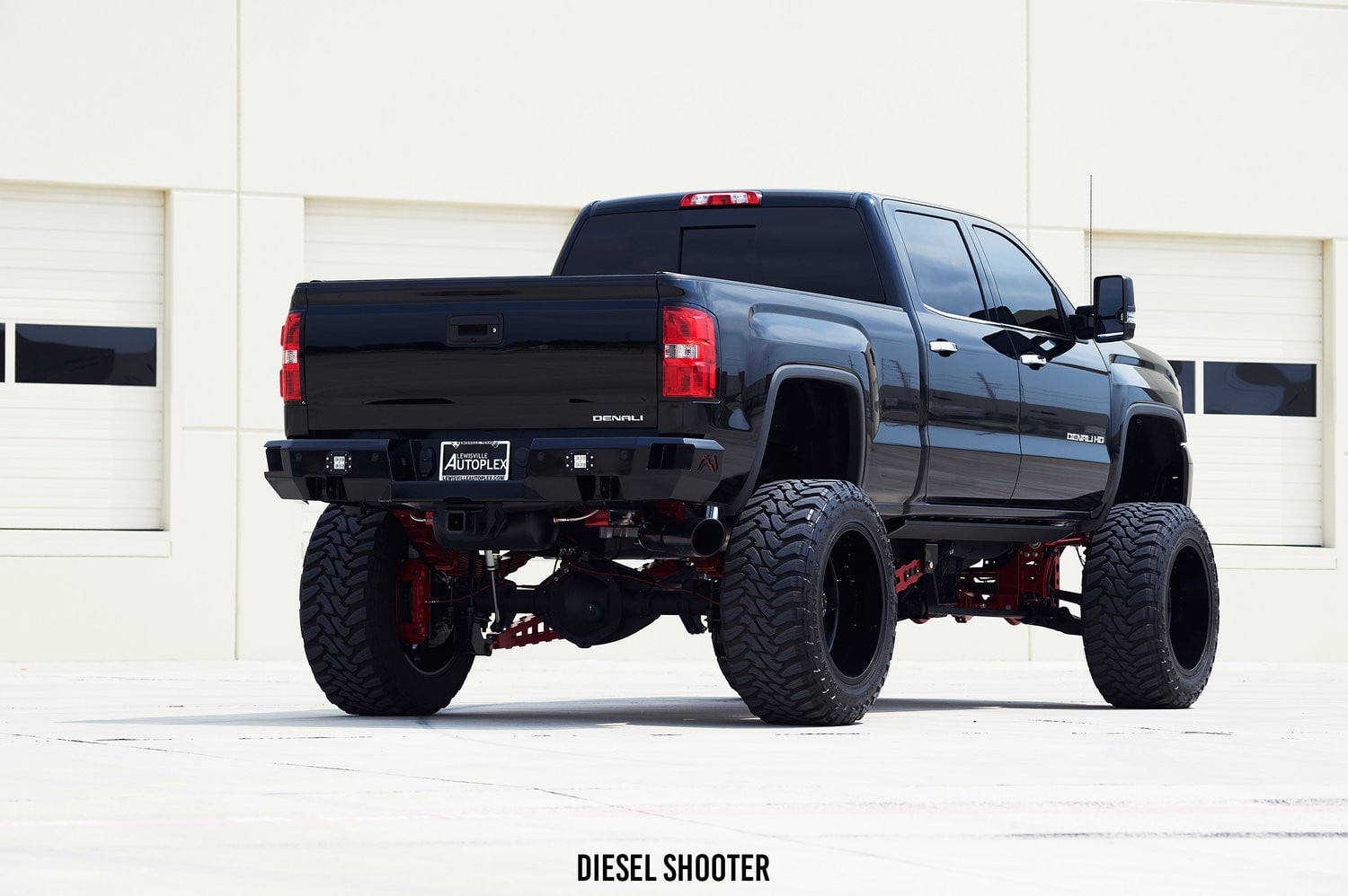 Powdercoated Lift Kit with Candy Red Shocks on GMC Sierra - Photo by Diesel Shooter