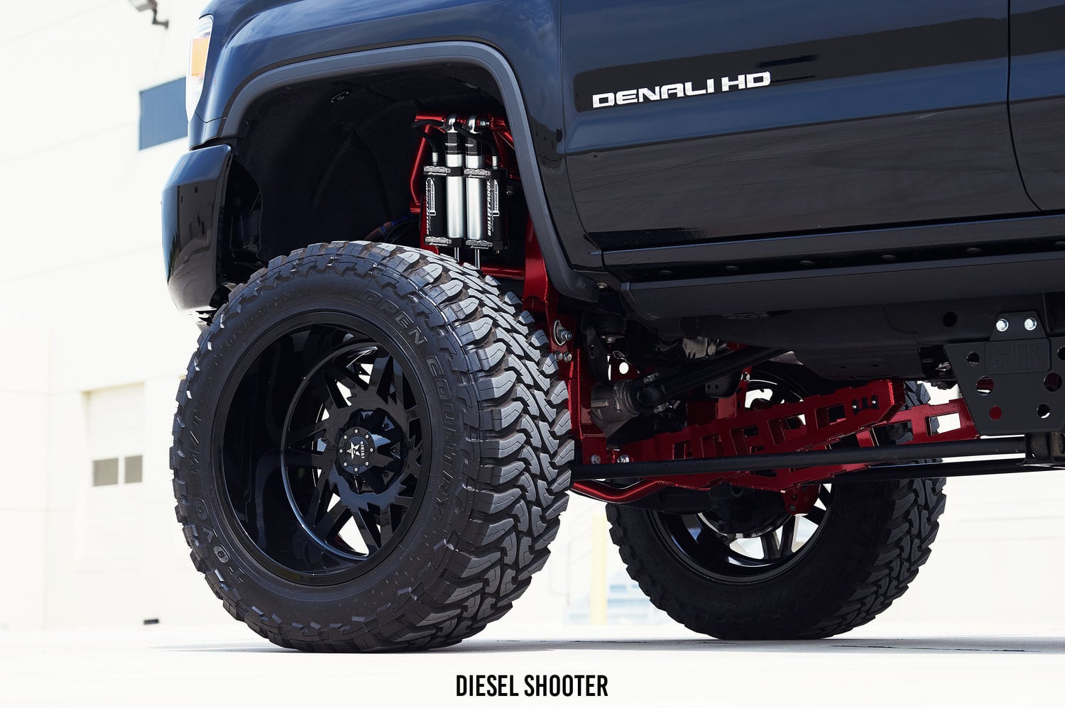 Lifted GMC Sierra with Dual Aluminum Bulletproof Shocks - Photo by Diesel Shooter