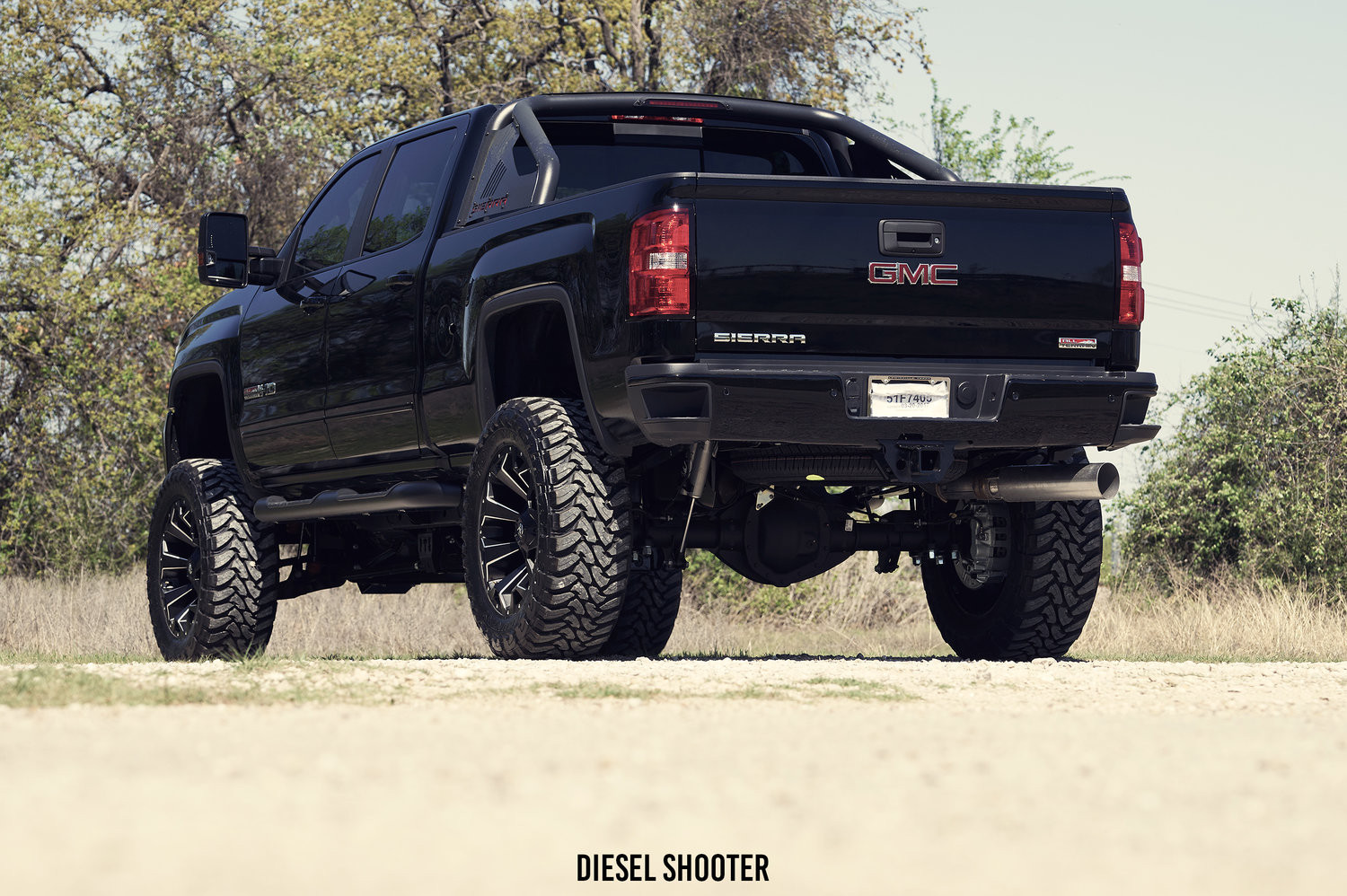 Lifted GMC Sierra with Black Bed Mount Sport Bar - Photo by Gmc Sierra