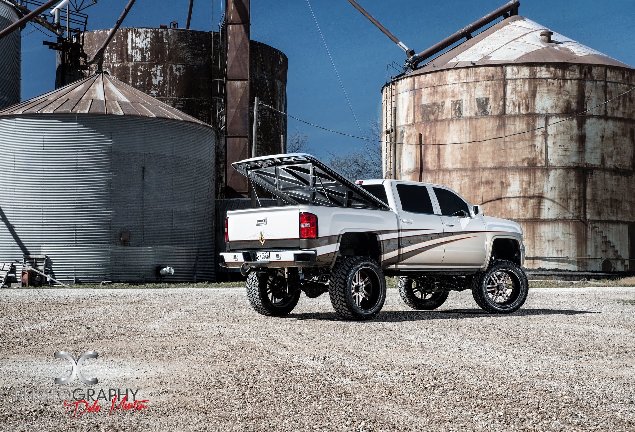 Lifted Truck With an open Tonneau Cover - Photo by Dale Martin