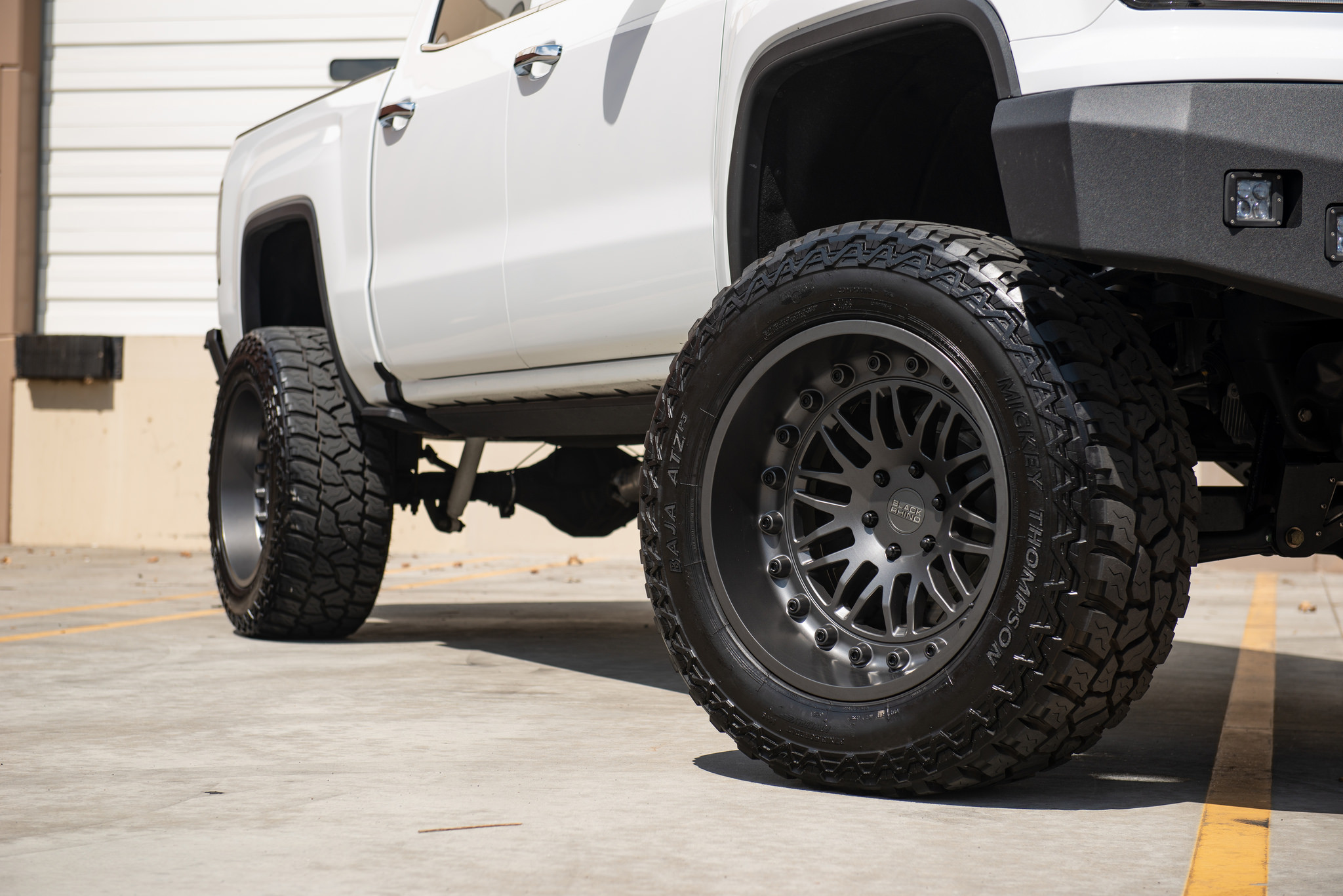 White Lifted GMC Sierra on Mickey Thompson Tires - Photo by Black Rhino Wheels