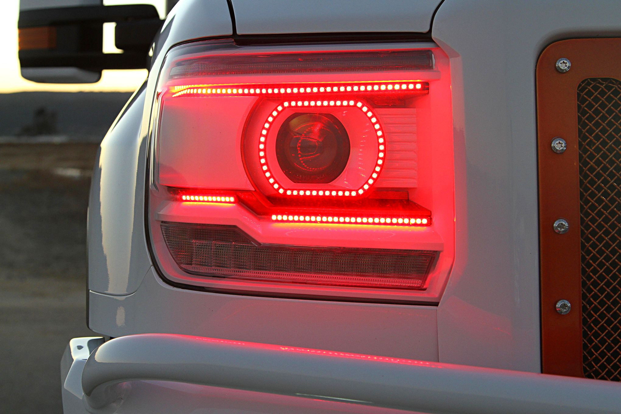 GMC Sierra with custom red LED headlights - Photo by Mike Alexander