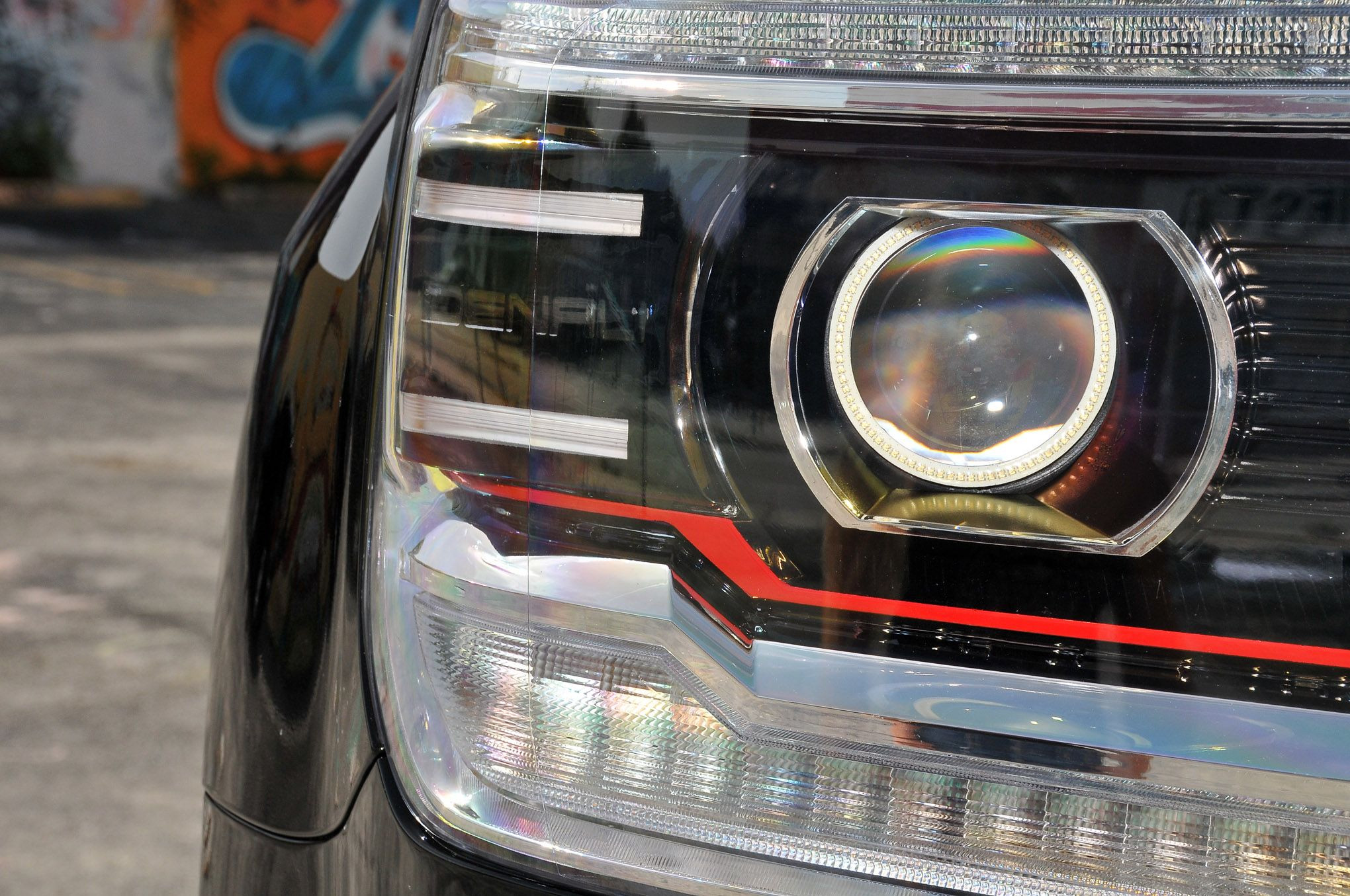 Black Lifted GMC Sierra Denali with Custom Headlights - Photo by Phil Gordon