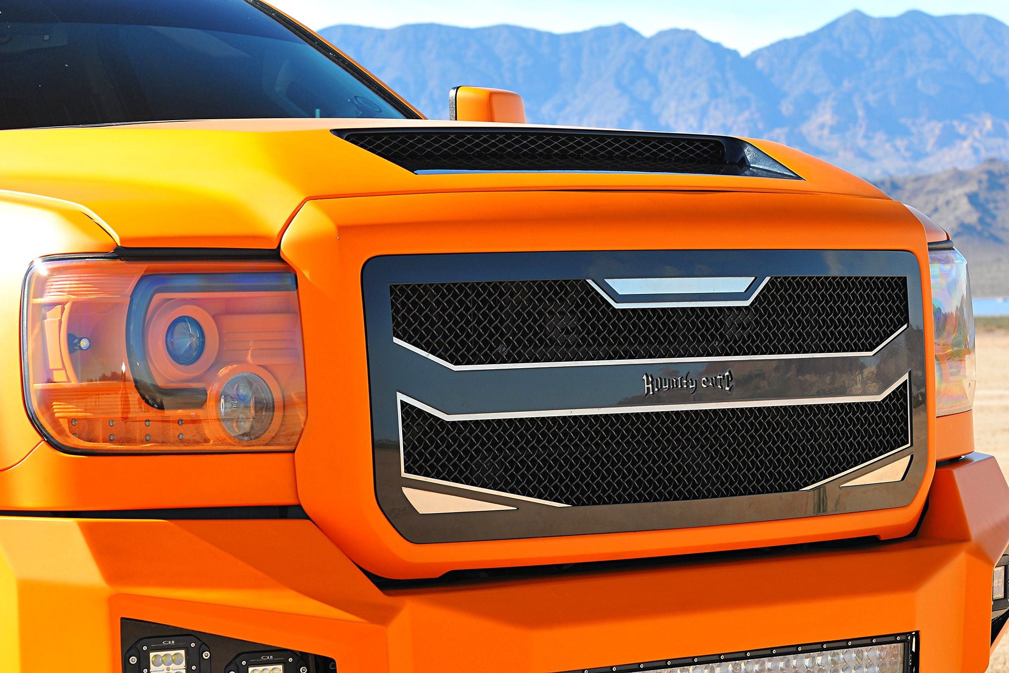 Orange GMC Sierra Denali with Royalty Core Grille - Photo by Phil Gordon