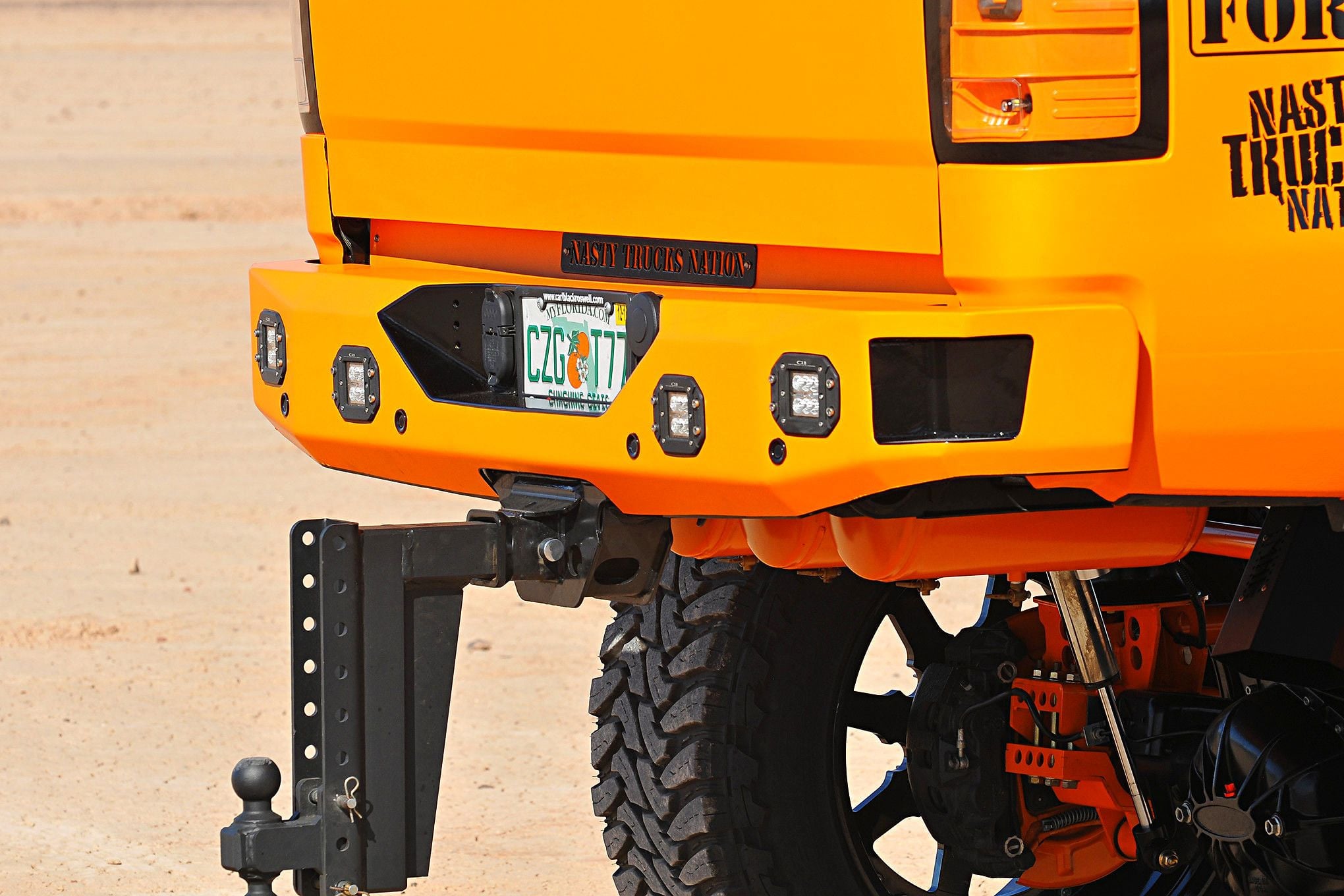 Orange GMC Sierra Denali with Off-Road Rear Bumper - Photo by Phil Gordon