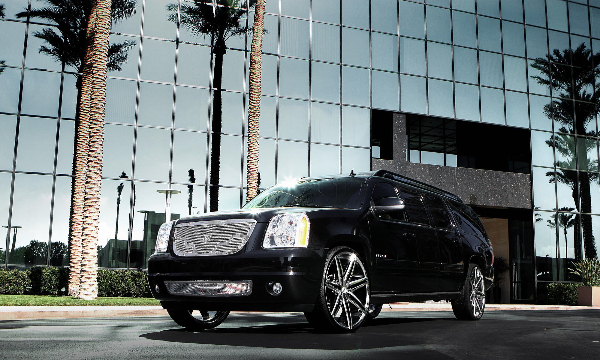 Black GMC Yukon XL with Chrome Lexani Wheels - Photo by Lexani