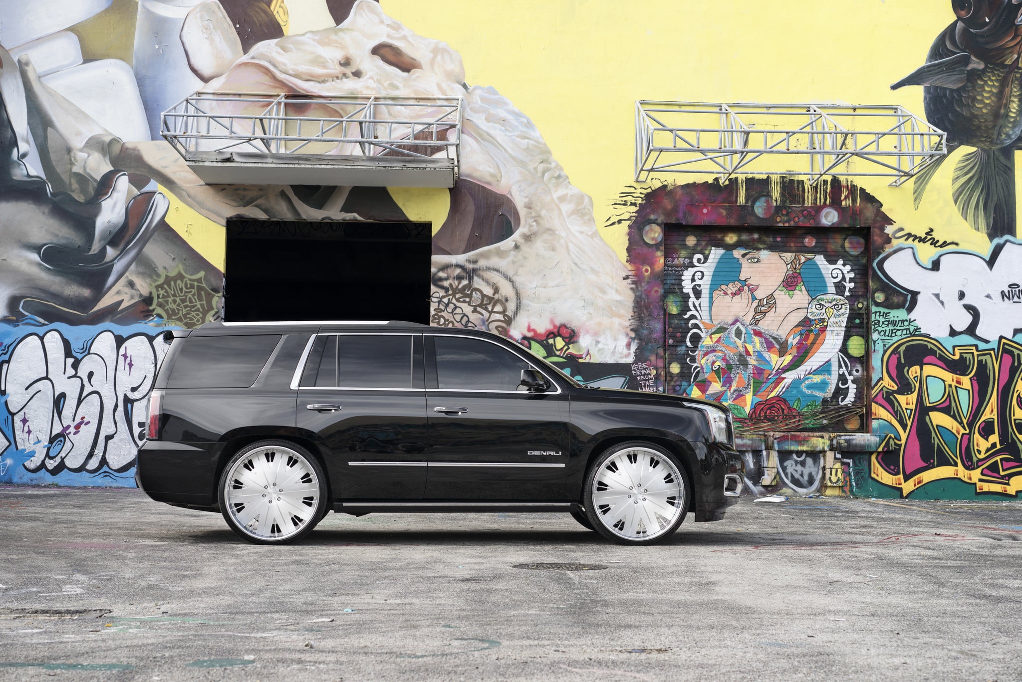 Black GMC Yukon Denali with Aftermarket Running Boards - Photo by DUB