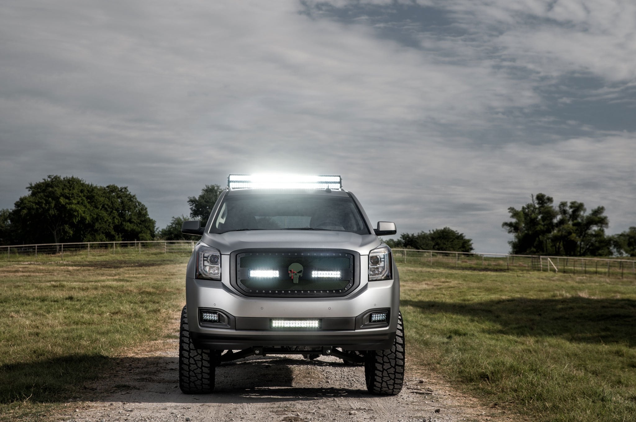 Off-road Modified GMC Yukon XL with Mud Tires and Roof Rack | CARiD.com ...