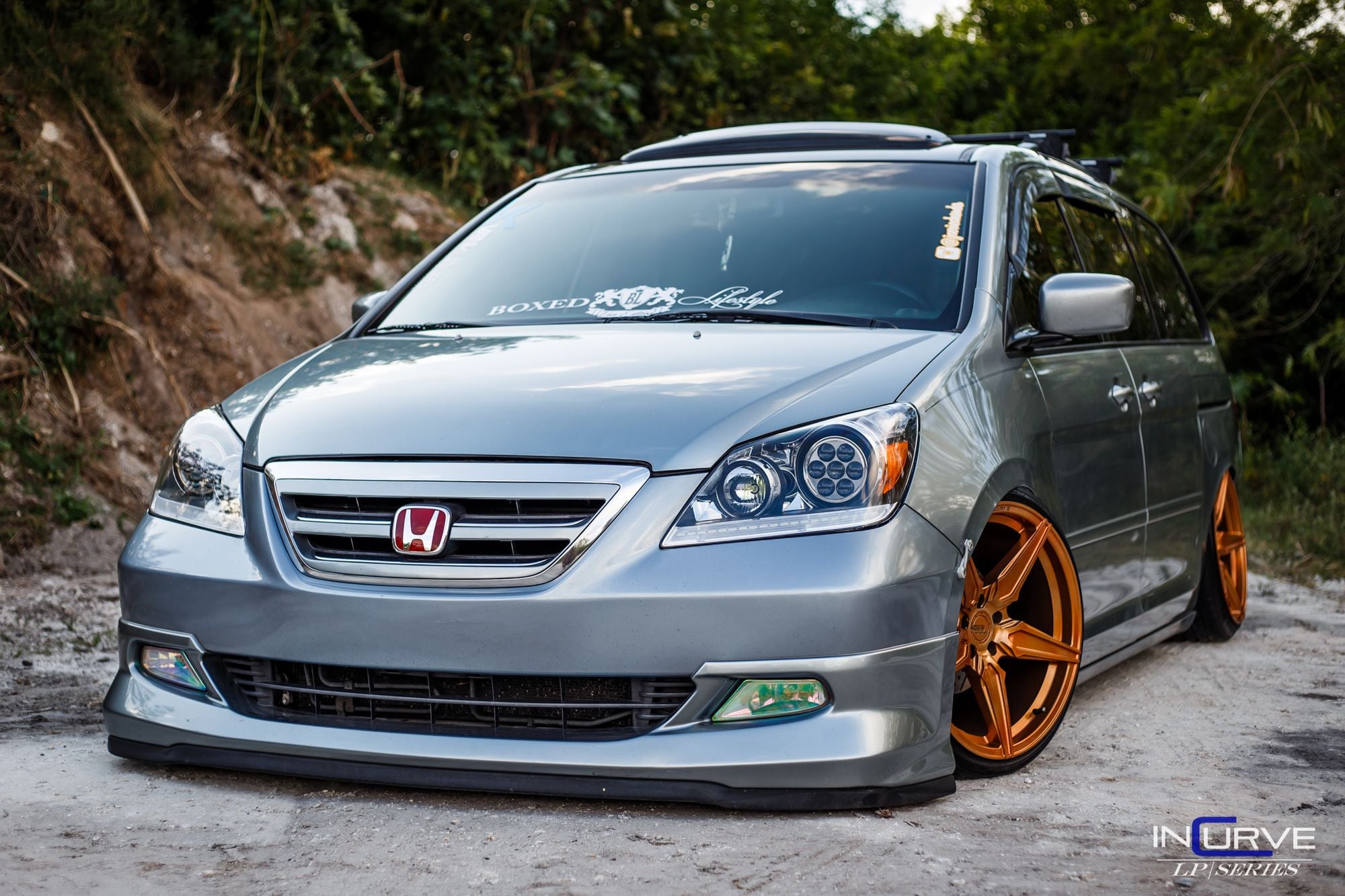 Aftermarket LED Headlights on Gray Honda Odyssey - Photo by Incurve Wheels