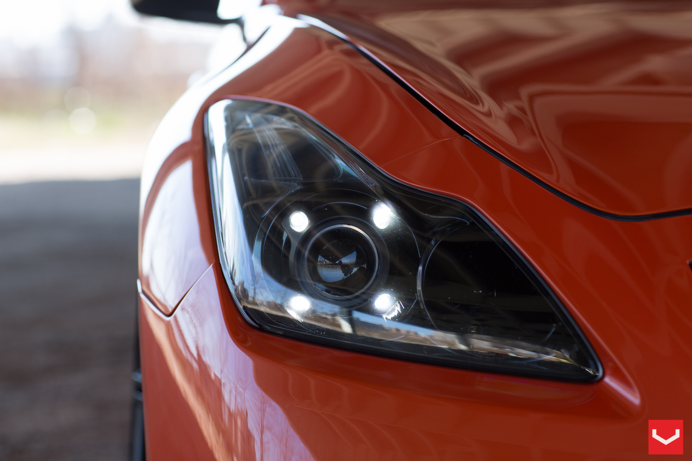 Orange Infiniti G37 with Custom Dark Smoke LED Headlights - Photo by Vossen