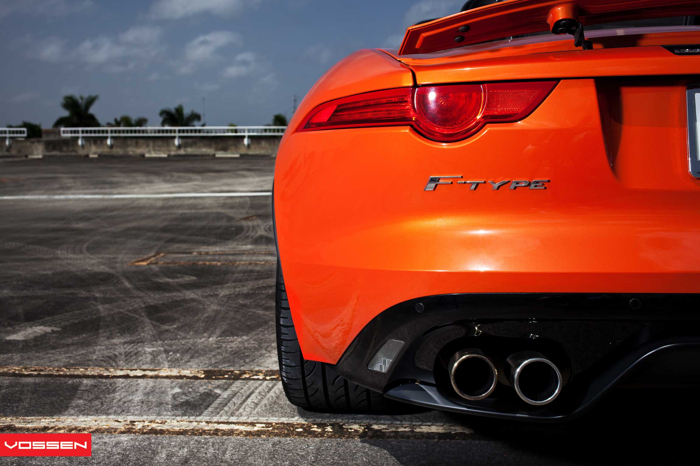 Exhaust System with Dual Tips on Orange Jaguar F-Type - Photo by Vossen